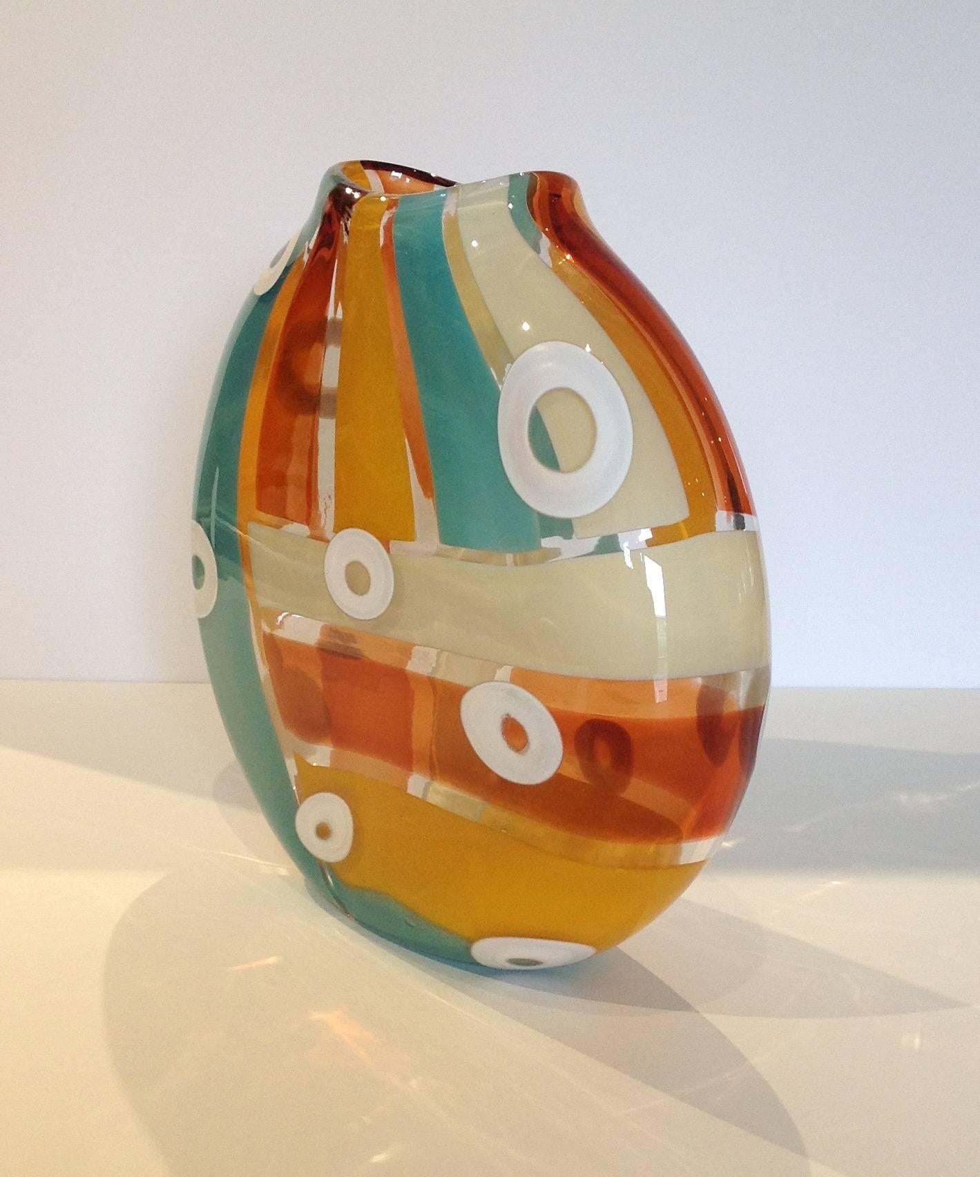 Leigh Taylor Wyatt has been working with glass since 1993. From vessel making to chandeliers she is enthralled with the processes of glass making. Leigh enjoys using the translucency of the material while creating patterns and textures within the