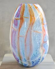 Big blown glass vase. Murano glass style colors purple, blue, orange and white.