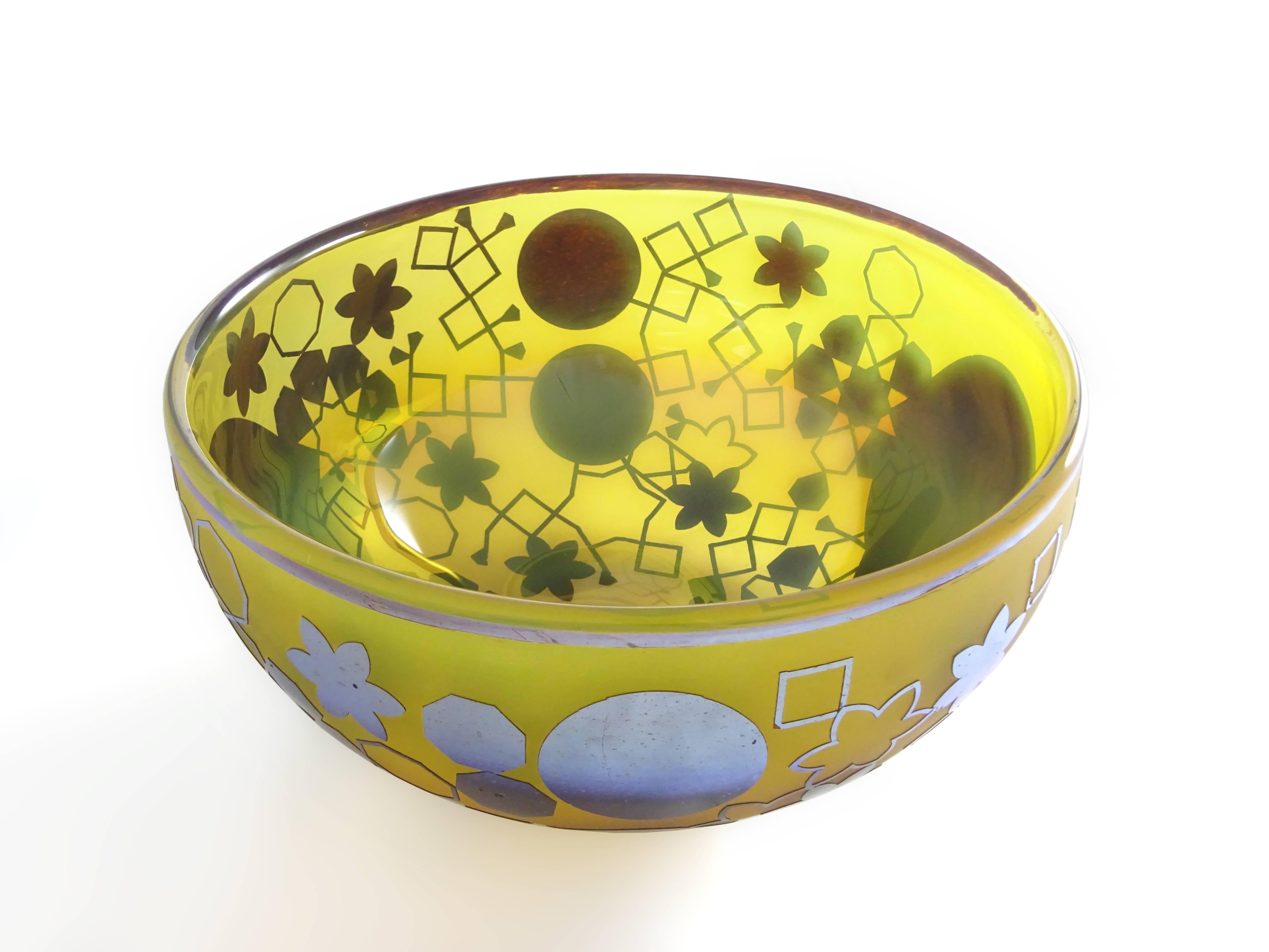 Blown glass bowl or vessel shaped sculpture. Yellow semi translucent glass with shiny glass decorations on the outside. This beautiful glass bowl exists of two blown glass layers. The first layer is made of yellow glass which becomes more of a ochre