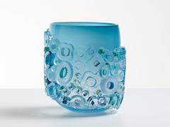 Murano glass style blue vase. Blue blown glass vessel with glass ornaments