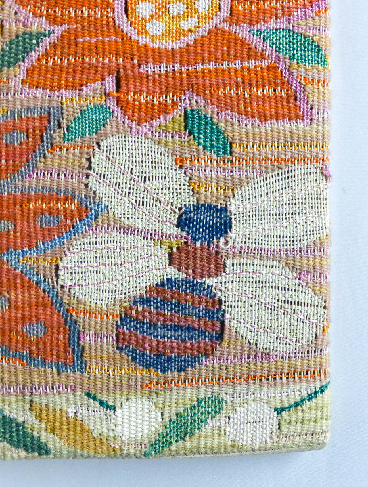 Very colorful and fun wool weaving. A rare piece of textile art by this well known Swedish artist. It is initialed in the weaving on the edge. Circa 1960's. Wool is placed over a wood stretcher for hanging.
