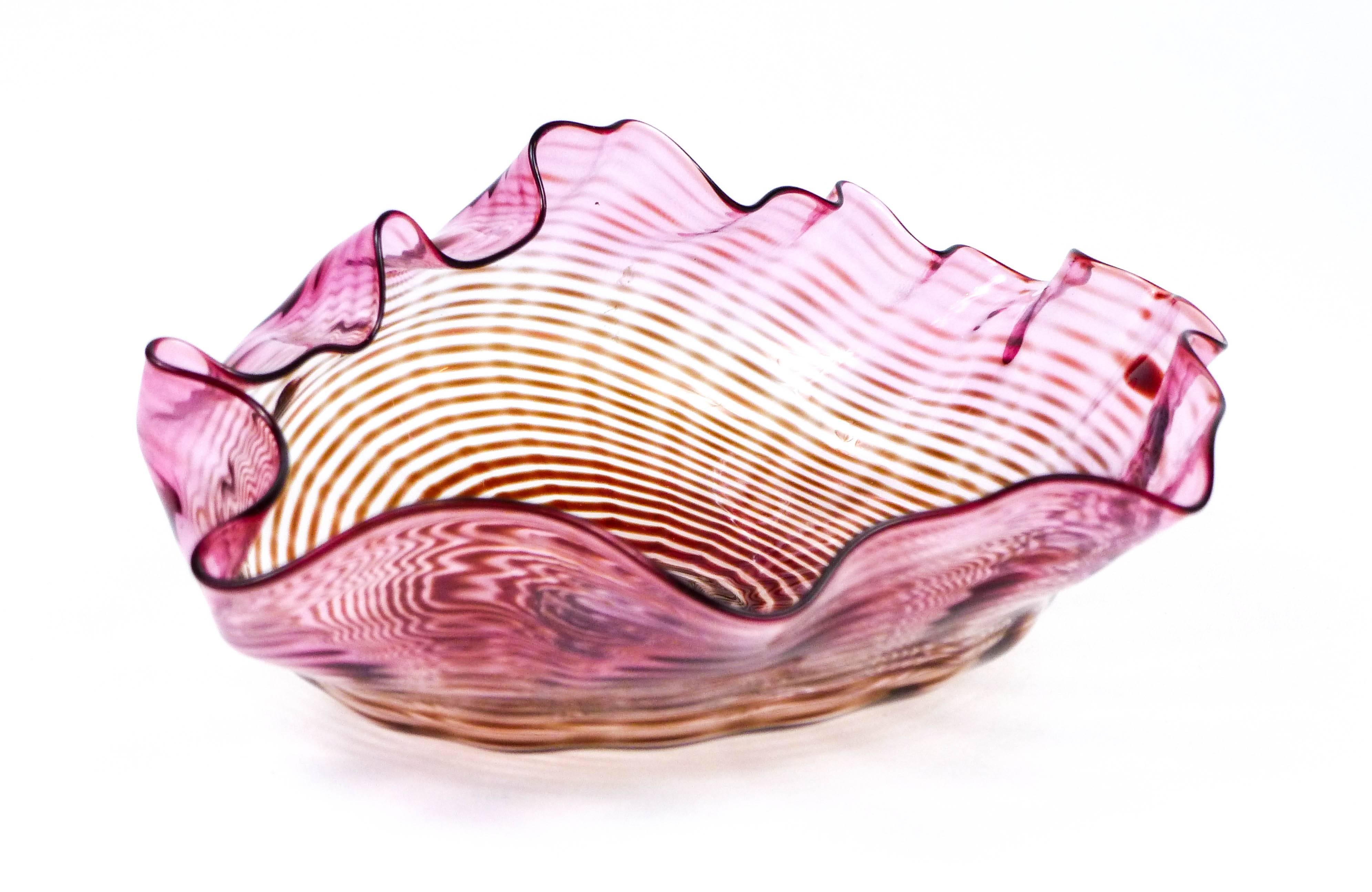 Here is an early miniature red seaform bowl by Dale Chihuly. This clam shell bowl is signed and dated 1982. It was purchased at the University of Illinois Craft Guild after Chihuly did a demonstration there in the early 1980's. Soft red coloring and