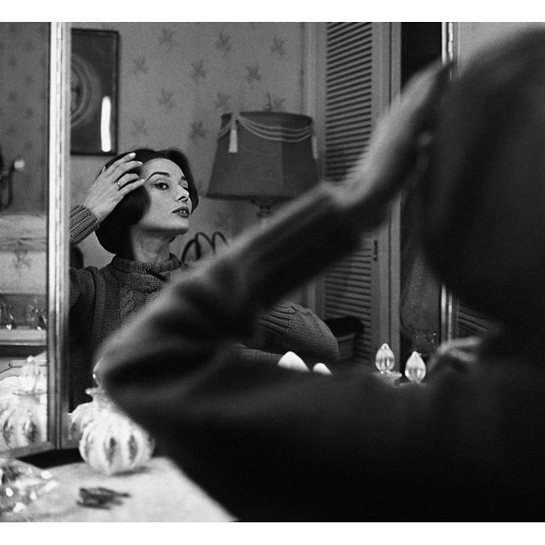 Sid Avery Black and White Photograph - Audrey Hepburn at Her Dressing Room Mirror (From Left)
