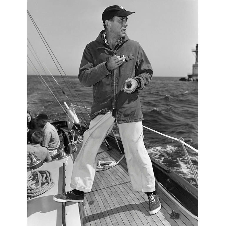 Sid Avery Black and White Photograph - Humphrey Bogart on his Yacht "Santana"