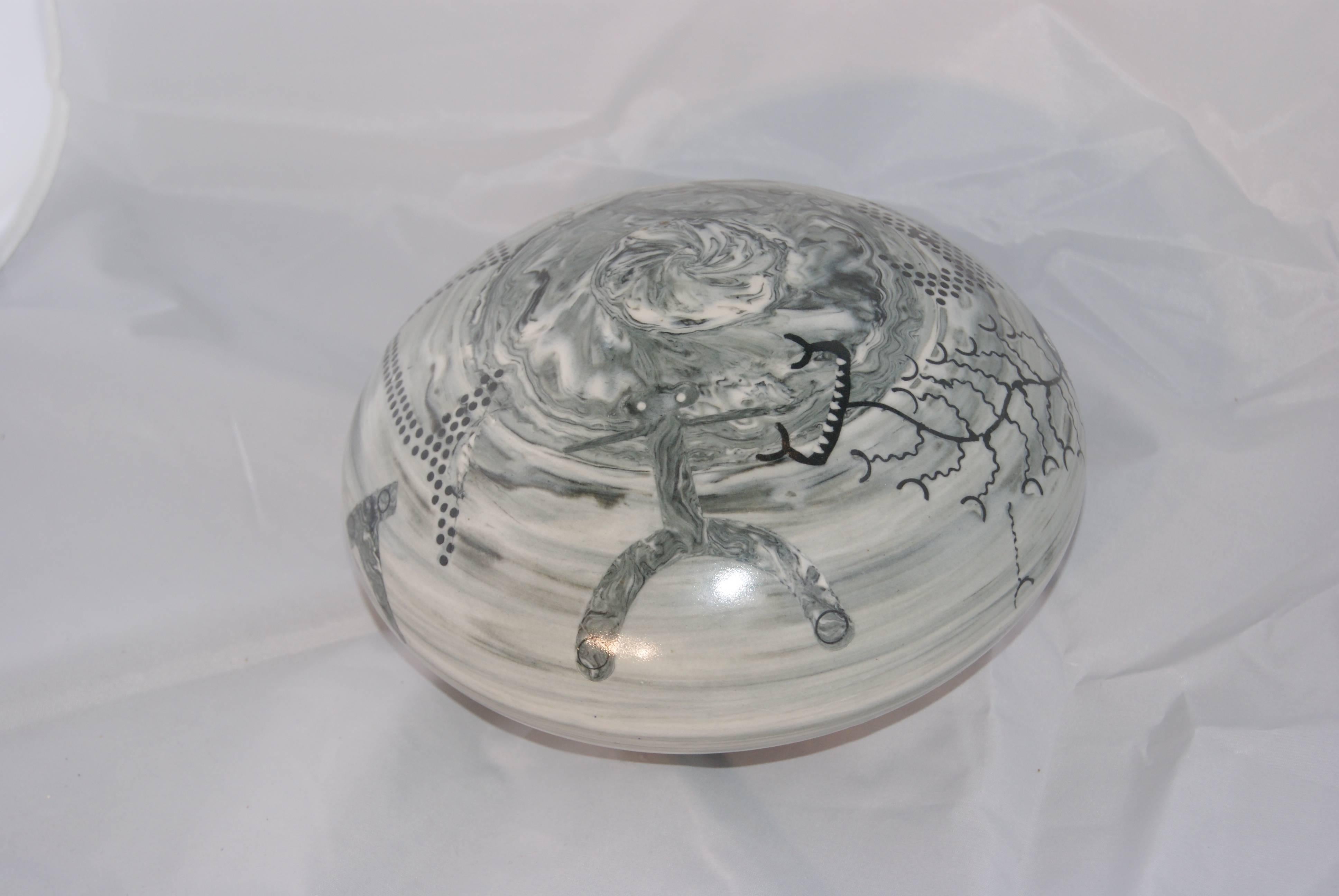 Tom’s intricate ceramic pieces combine the techniques of inlay, nerikomi, scrafitto, and underglaze drawing with a porcelain clay body. He has appeared in American Crafts Magazine, Art in America, and interviewed in Arts and Activities, as well as