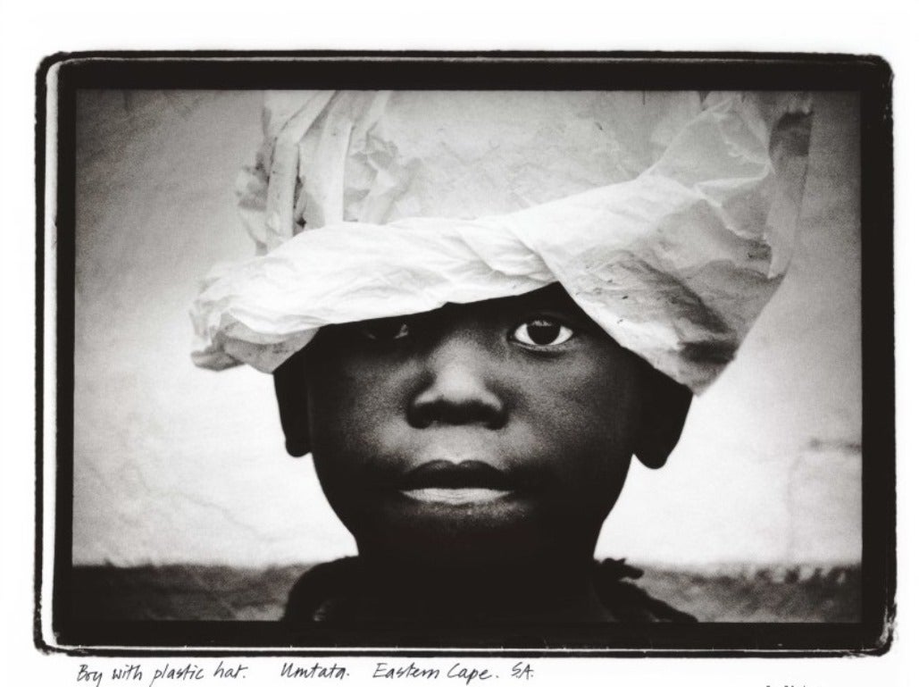 Obie Oberholzer Black and White Photograph - Boy with plastic hat