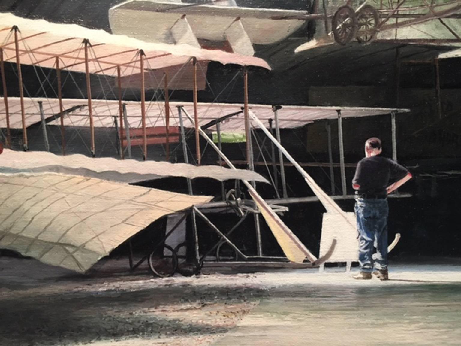 Photorealist painting airplane hangar, 