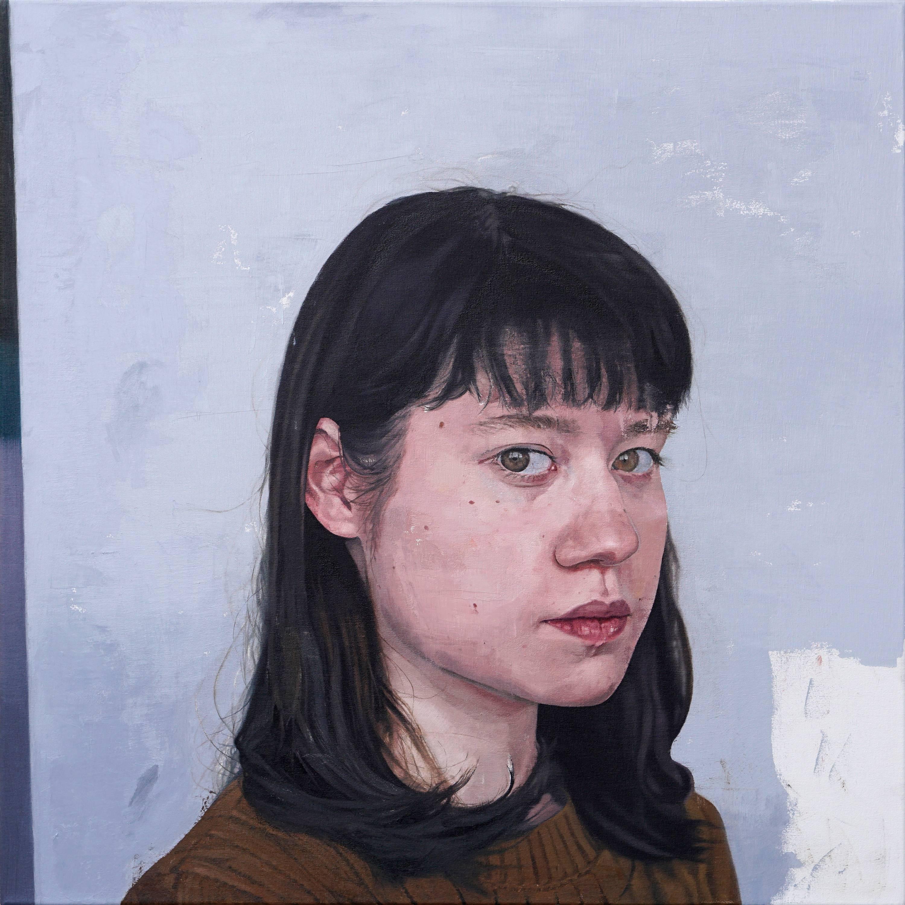 Park's "Untitled G" is large scale realist painting. The work features a head and shoulder portrait of a young woman with dark hair and bangs set against a light blue background.  She sits with her body angled towards the viewer and her forward gaze