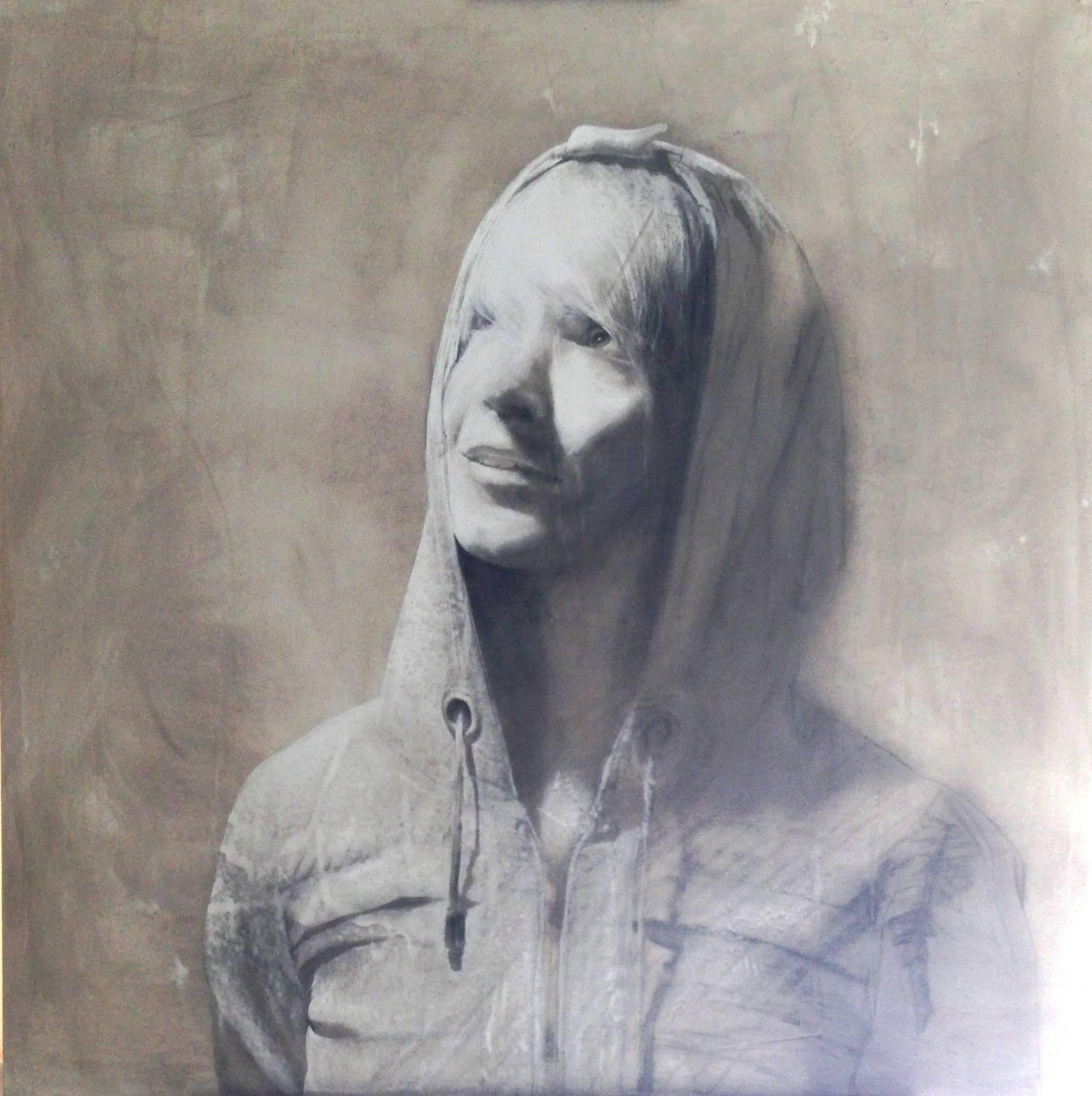 This mixed media work depicts a head and shoulders view of young woman with a hooded sweatshirt, wearing her hoodie pulled up over her head.  Looking up and to left and directly into an intense light source, she smiles with a parted lips and a