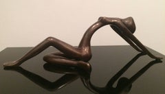 Stunning yoga back-bend in bronze.