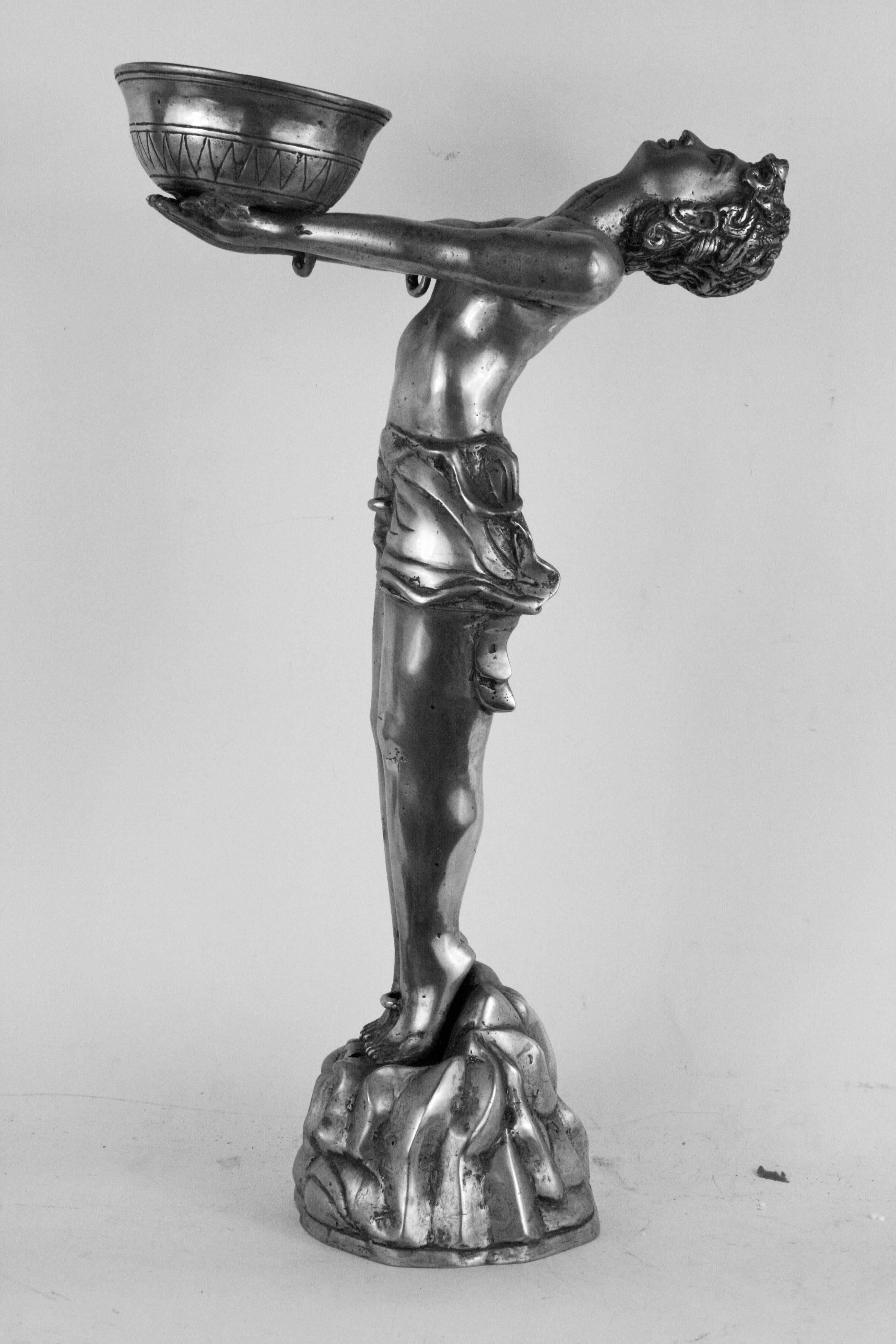 9-098 Deco sculpture  with outstretched arms supporting a vessel