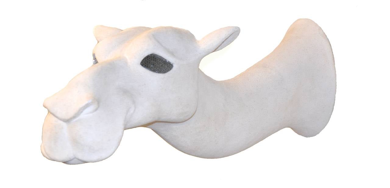We love this unique whimsical-yet-tres-modern white camel wall mounted sculpture. The artist is unknown but it's signed 