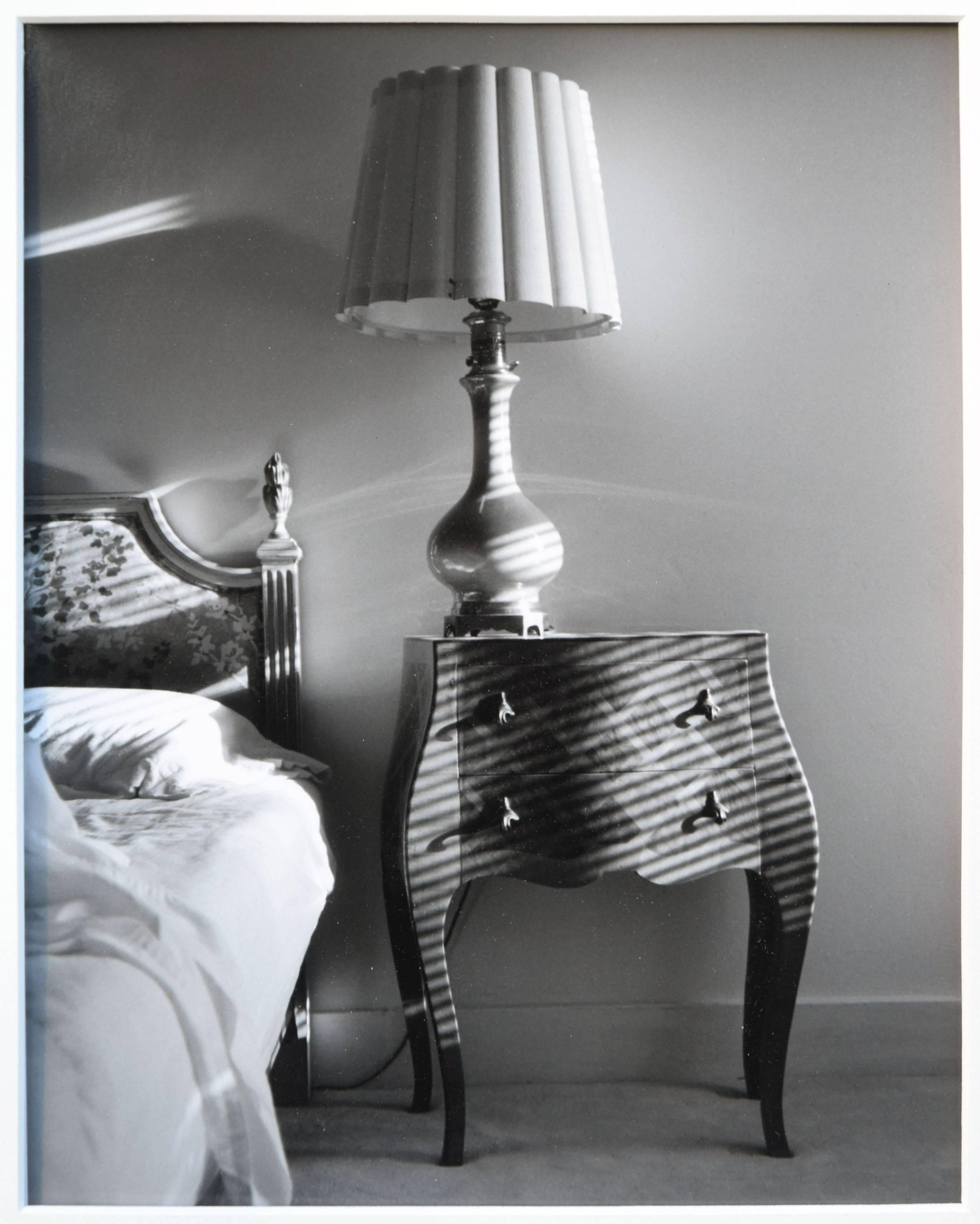 Table with Lamp - Black & White Bedroom Interior Photograph - Gray Still-Life Photograph by D. Smalen