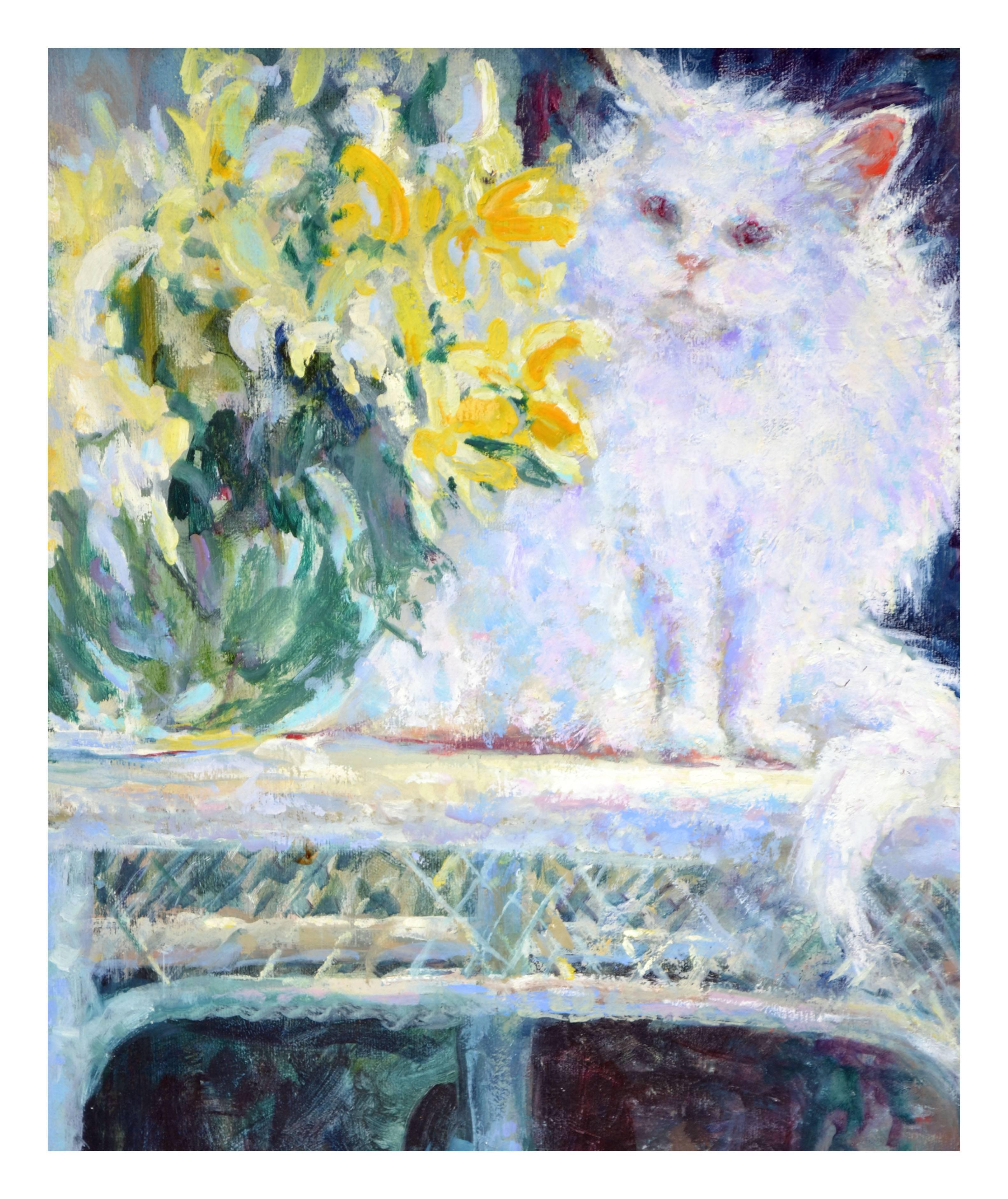 white cat at table