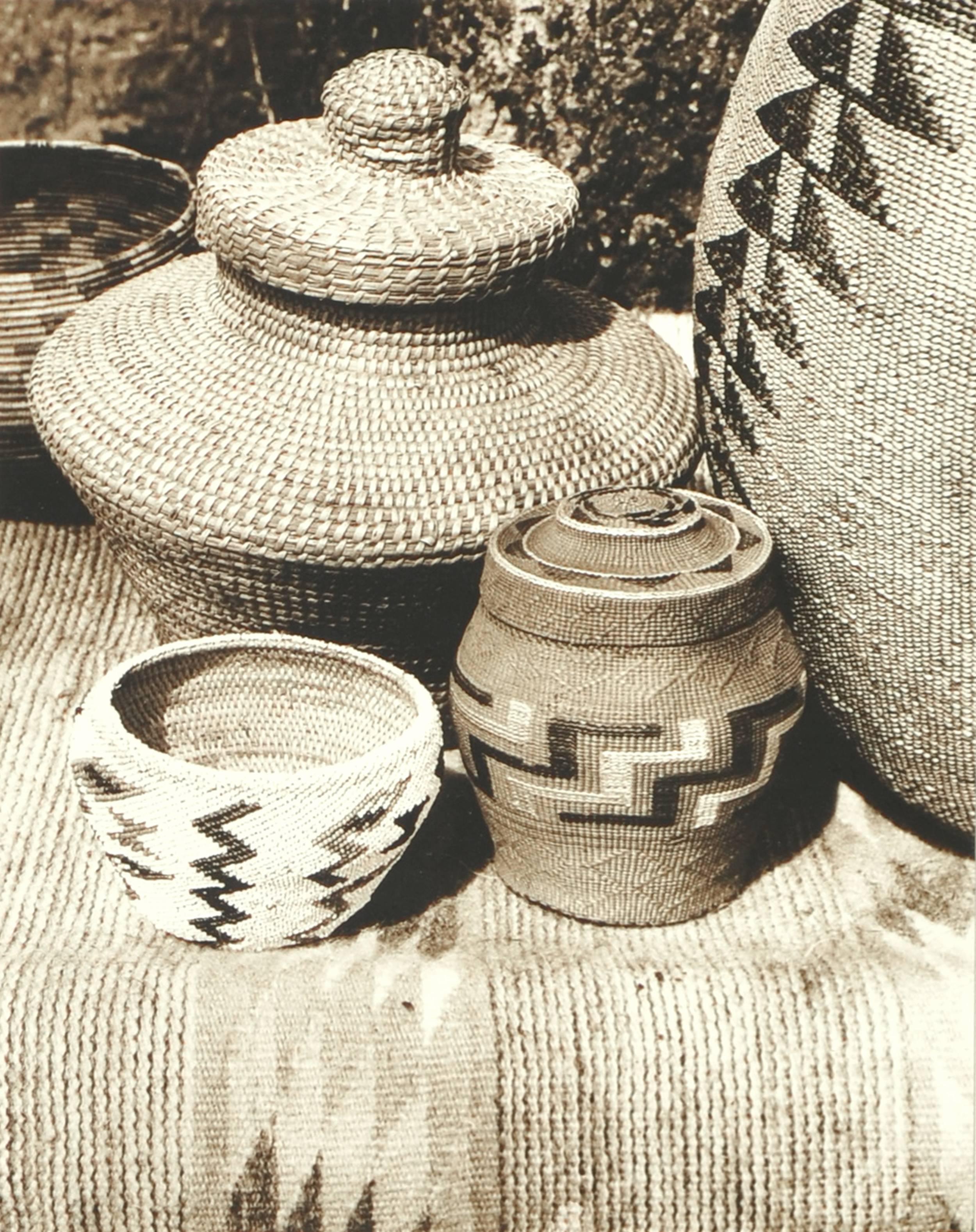 Indian Baskets - Set of 3 photographs

A set of three beautiful sepia tone photographs of Indian baskets by Nancy Maynard (American, 20th Century). Each of these photos highlights a different set of baskets, showing their delicate and complex