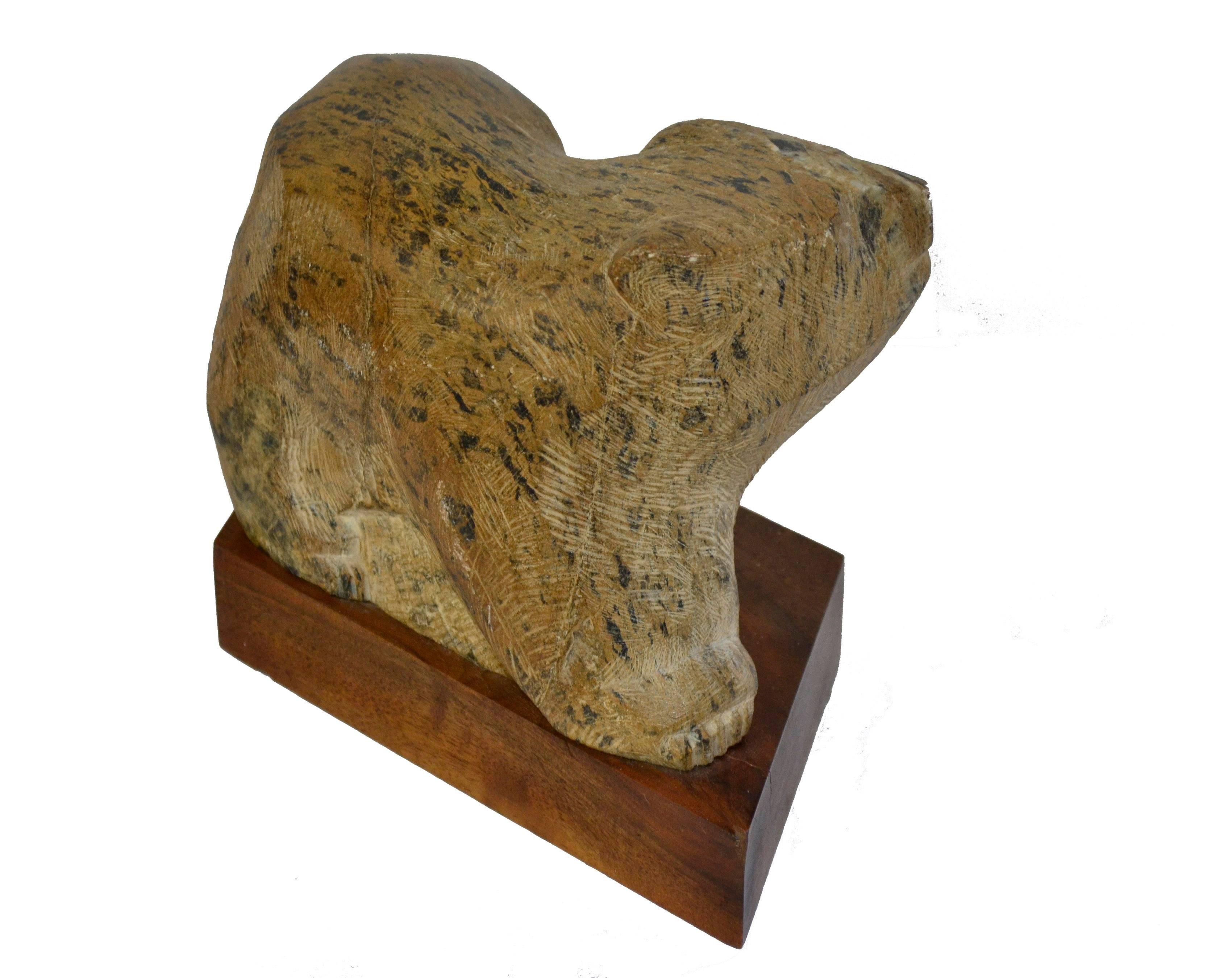 Steatite soapstone sculpture by Paul Buckner (American, 1933-2014) titled "Sunday Afternoon (Bear)". Presented on angled wood plinth. Buckner is a noted sculptor and Professor Emeritus at the University of Oregon's Department of Art.