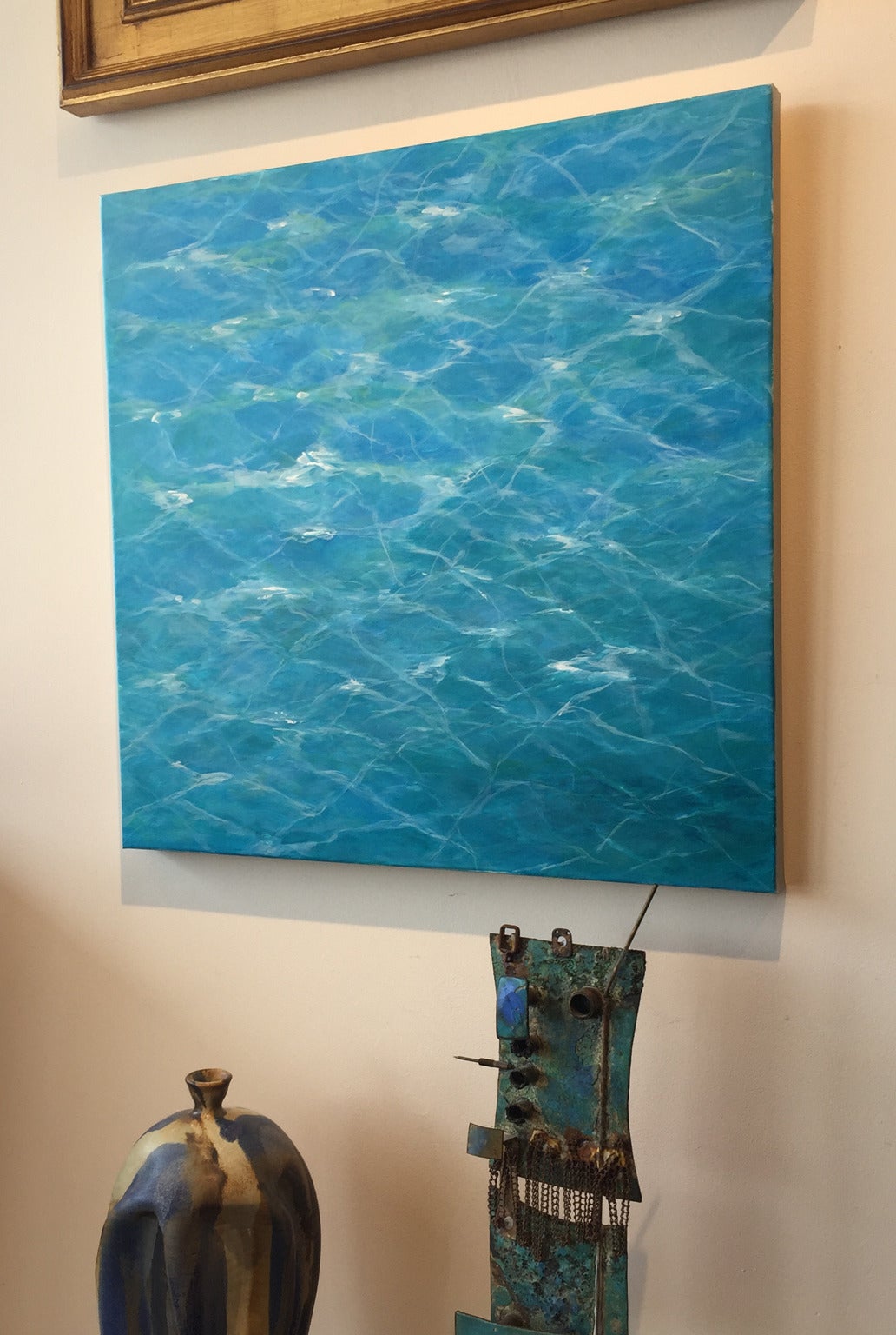 This calming half abstract half realistic painting is the artist's take on blue colors playing in an evening pool. In person, the painting is so vivid you almost feel/see water movement. 

Megan Ruch was born and raised in Albany, NY. She