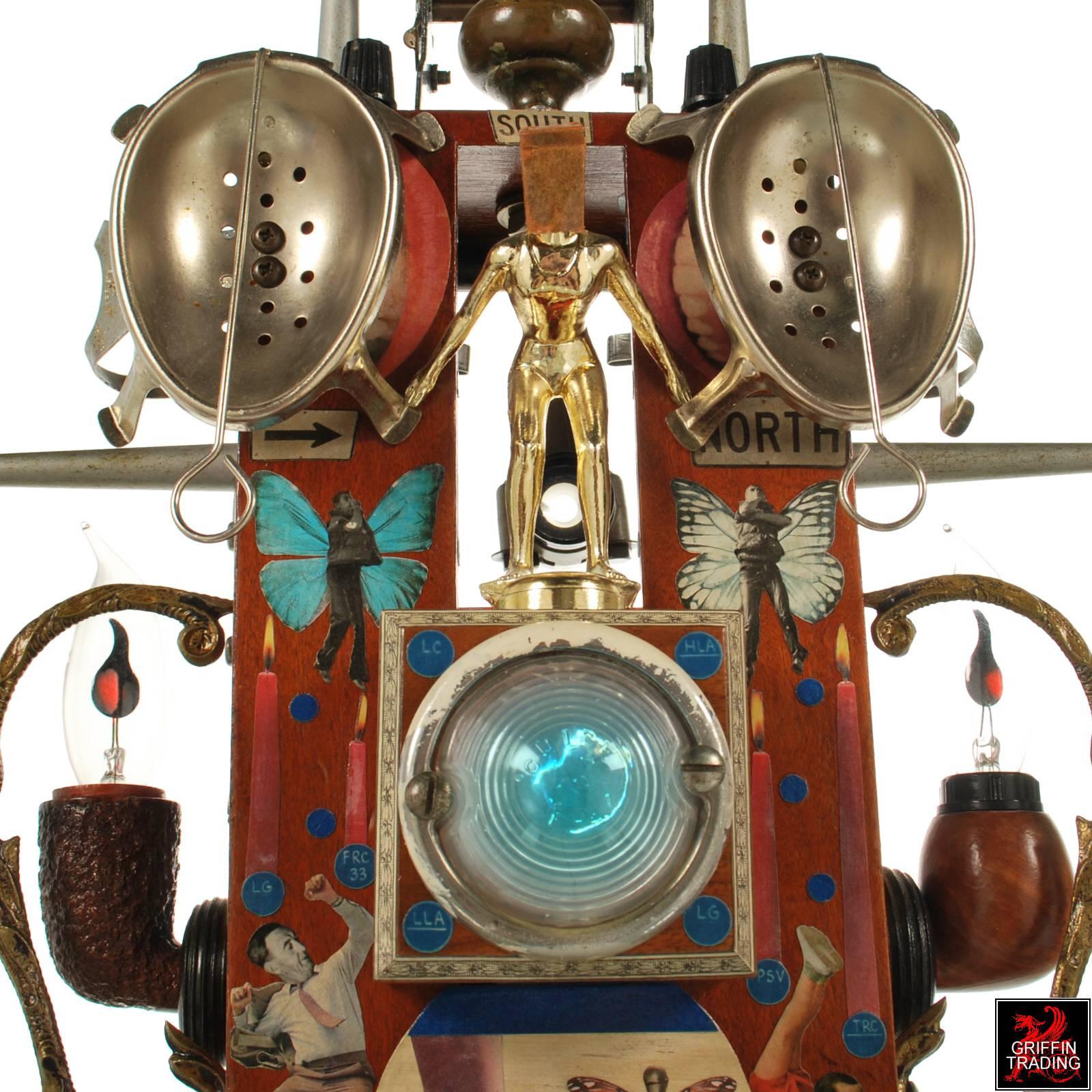 This whimsical and meticulous artwork is titled Leap Of Faith. The artist who created this mixed media assemblage is Michael Ciszek. There is so much to see and explore on this wonderful work of art. The closer you look the more you find. When you