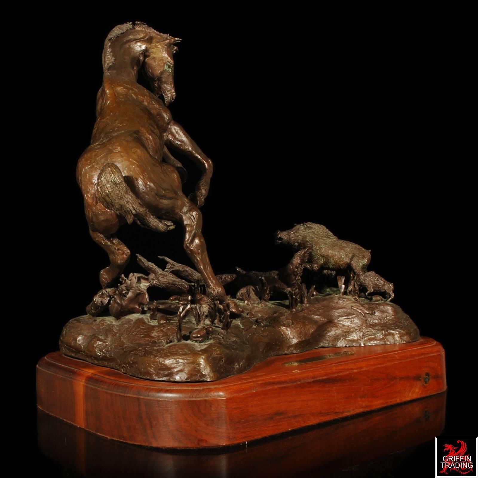 This striking bronze depicts a horse startled by a wild hog and her baby. The artist captured all the action and movement one would expect to see in this real life occurrence. Every detail has been included on this bronze, complete with the hair on