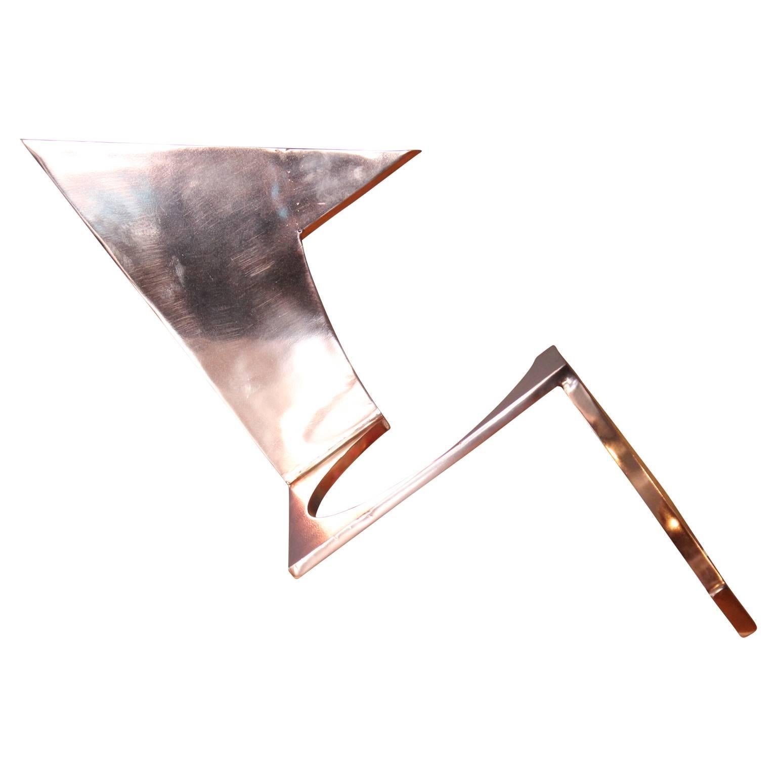 Geometrically shaped copper sculpture. The piece is the tone of shiny bright copper and has circular and triangular shapes to the work. It is not signed. 

Artist Biography: Matthew Reeves is the owner of Reeves Art & Design. He graduated from the