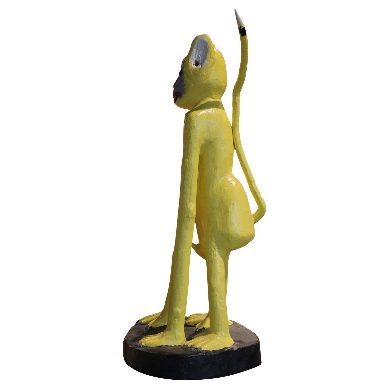 Lovely yellow monkey wood carving by well renown folk artist Isaac Smith. 

Artist biography as found at San Angel Folk Art: 

(b. 1944; Winnsboro, LA)

Isaac Smith is one of the most prominent African-American visionary artists in the United States