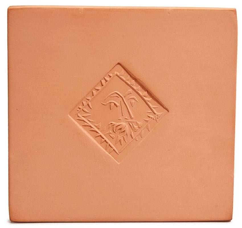 This red earthenware terra cotta tile was created in 1971. Stamped, marked and numbered 'Poinçon Original de Picasso/Madoura Plein Feu (verso), from the edition of 500 it measures 6 x 6 inches (15 x 15 cm.). (A.R. 628)

Accompanied by Certificate