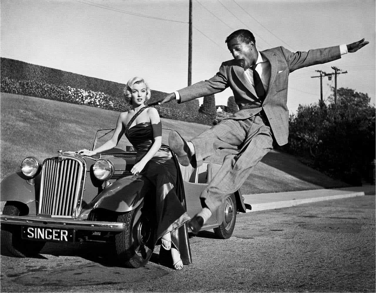 Frank Worth Black and White Photograph - Sammy Davis Jr. Leaps for Marilyn Monroe Fine Art Print
