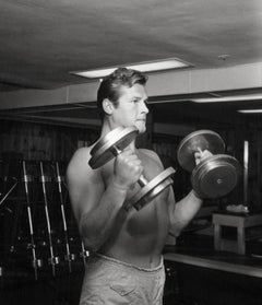 Shirtless Roger Moore Pumping Iron Fine Art Print