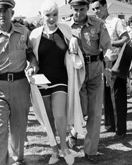 Vintage Marilyn Monroe in Swimsuit Escorted by police From Fans
