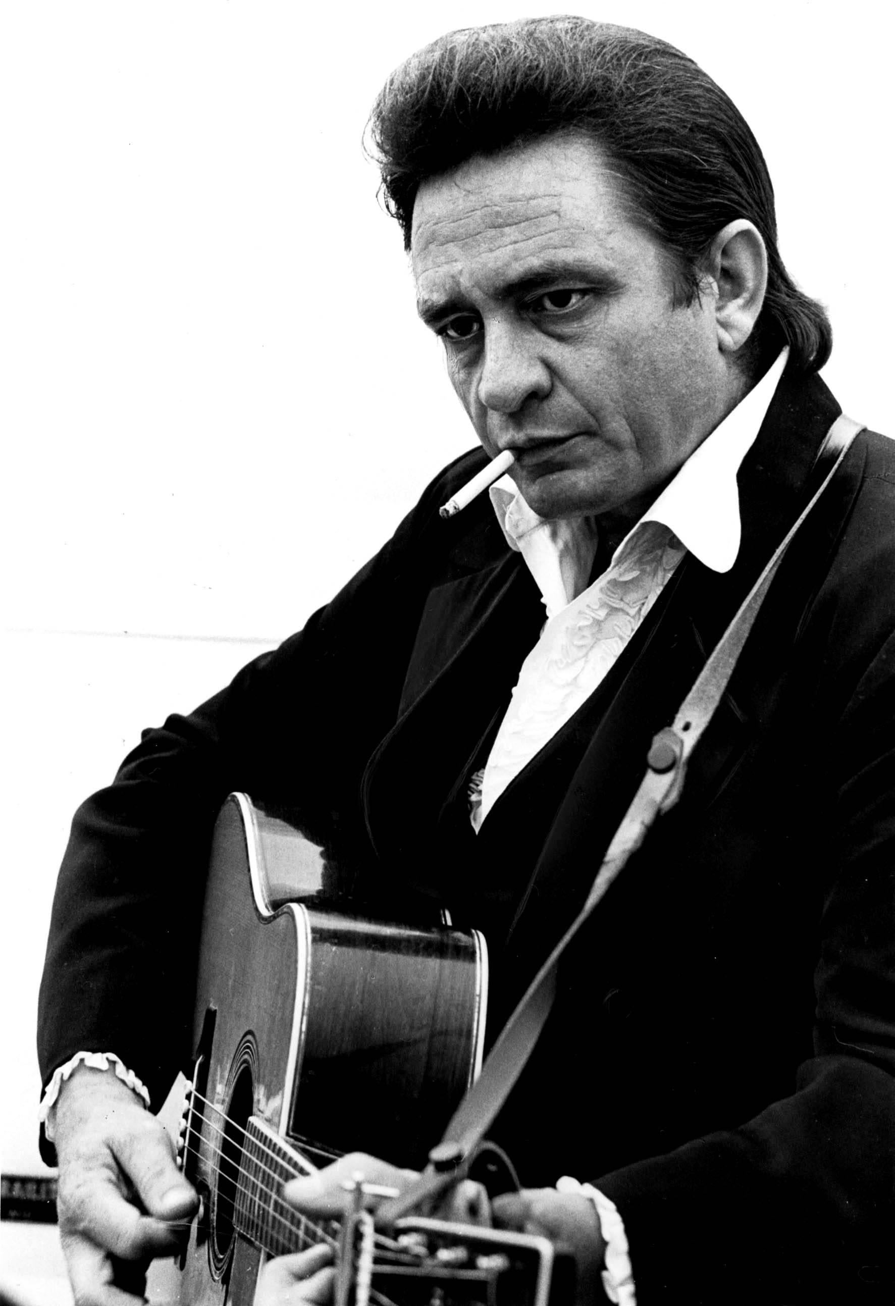 Unknown Portrait Photograph - Johnny Cash with Guitar and Cigarette Fine Art Print