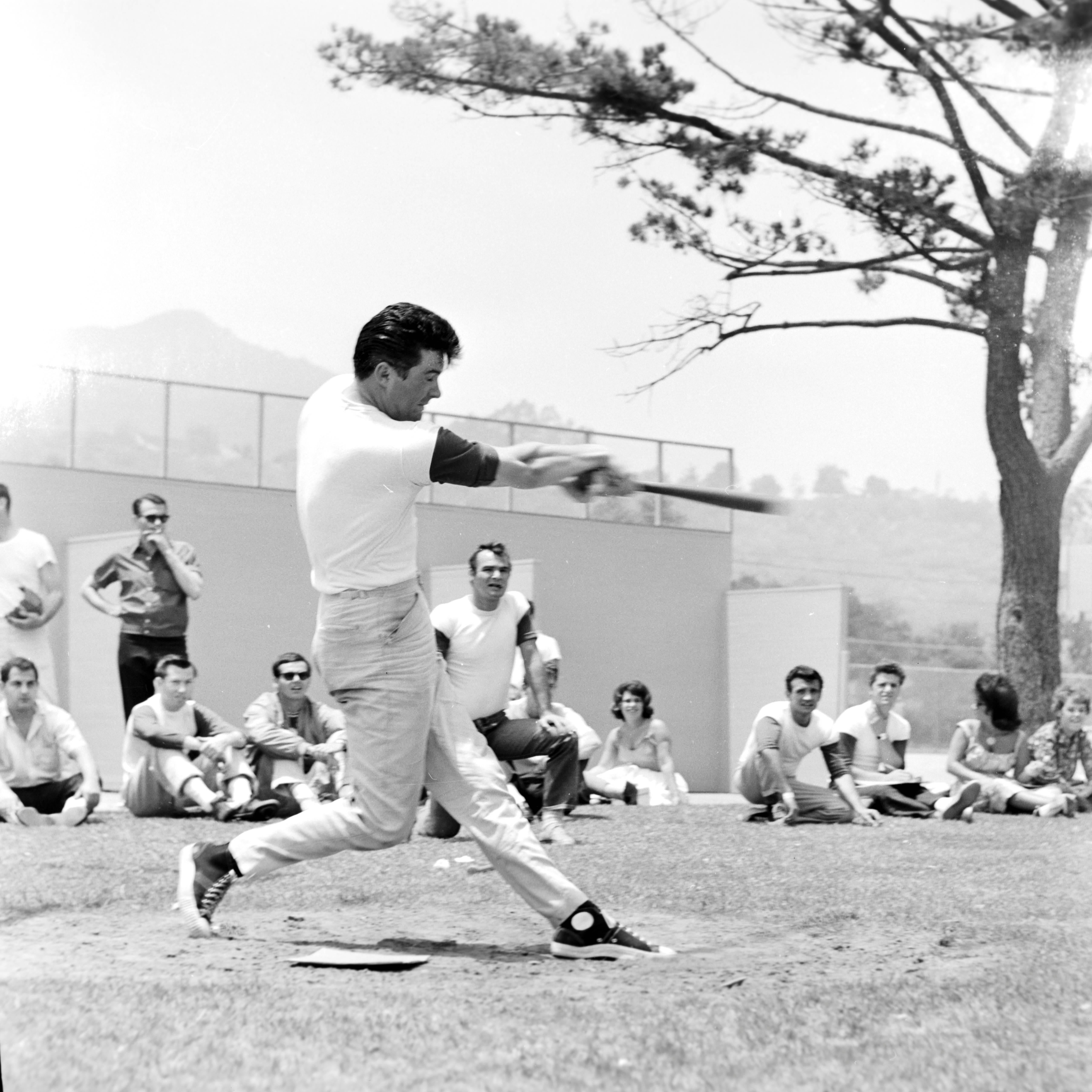 Larry Barbier Black and White Photograph - Burt Reynolds Playing Baseball Fine Art Print