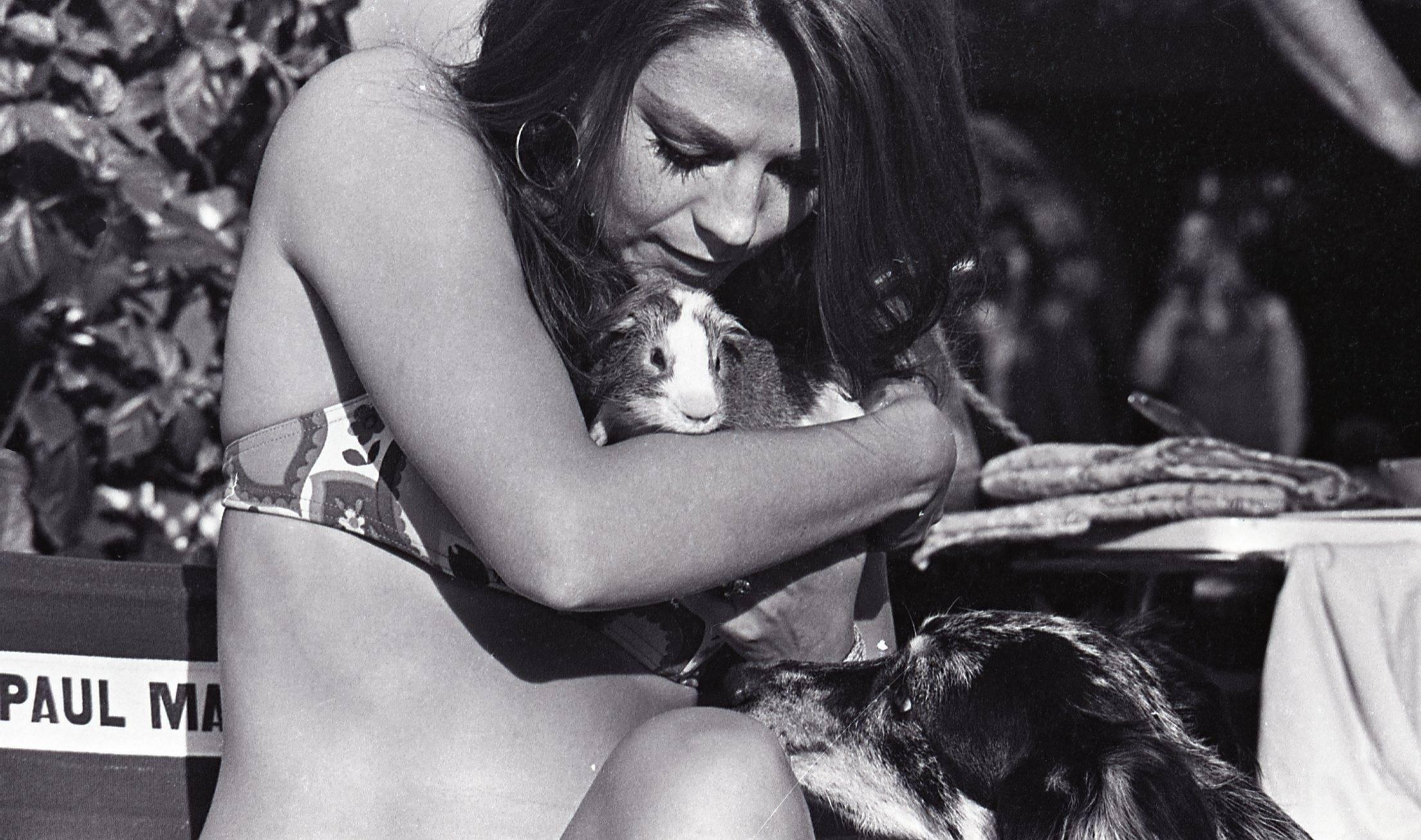 Unknown Portrait Photograph - Natalie Wood in Bikini Holding Small Animal Fine Art Print
