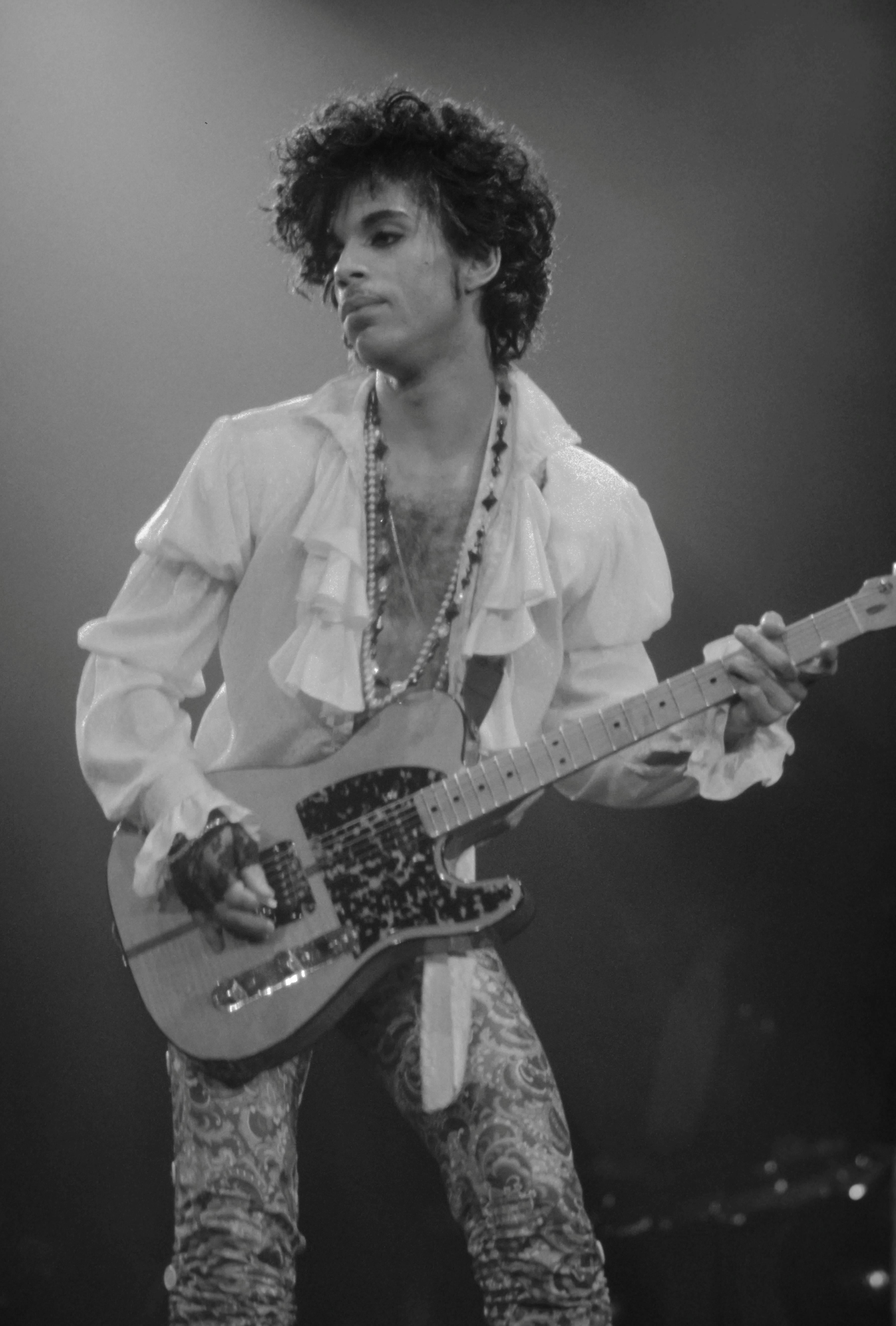David Plastik Portrait Photograph - Prince Playing Guitar on Stage Fine Art Print