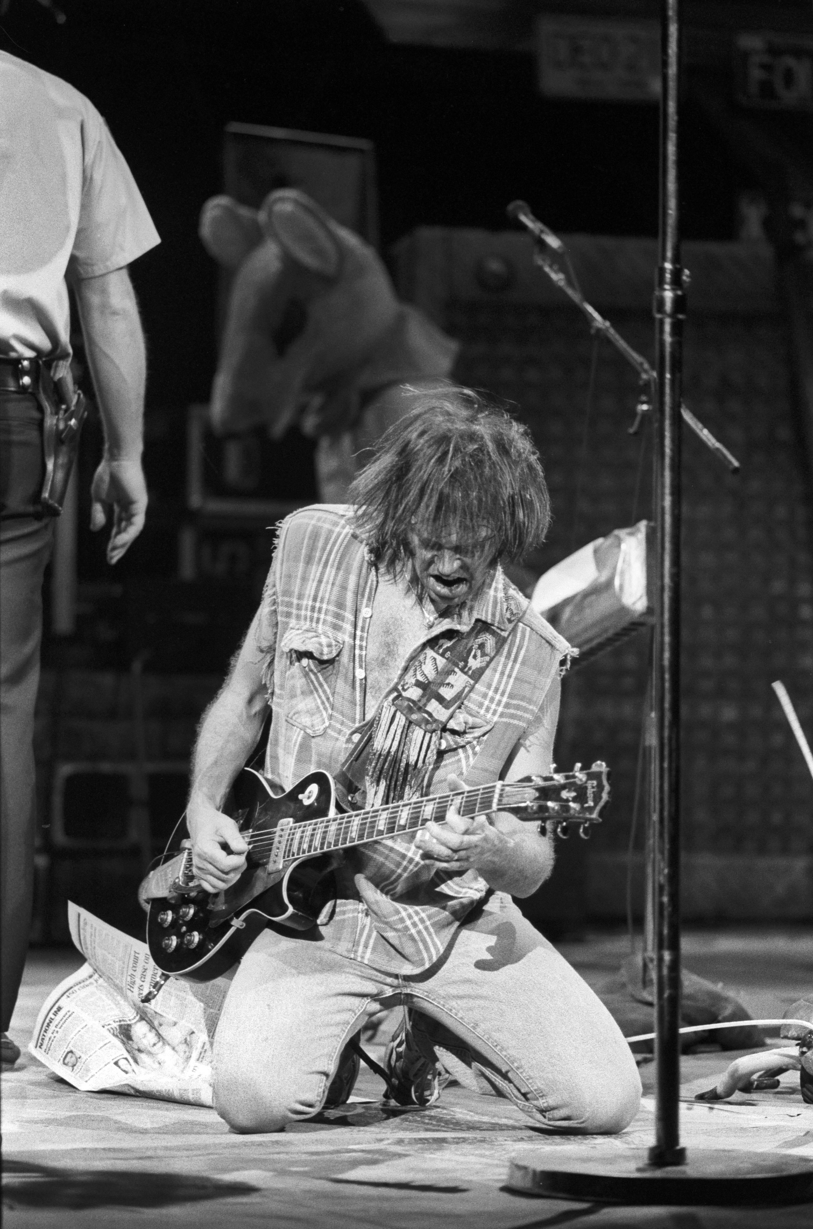 David Plastik Portrait Photograph - Neil Young Rocking Out on Stage, Falling to Knees Fine Art Print
