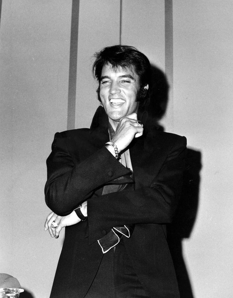 Phil Roach Black and White Photograph - Elvis Laughing at a Press Conference