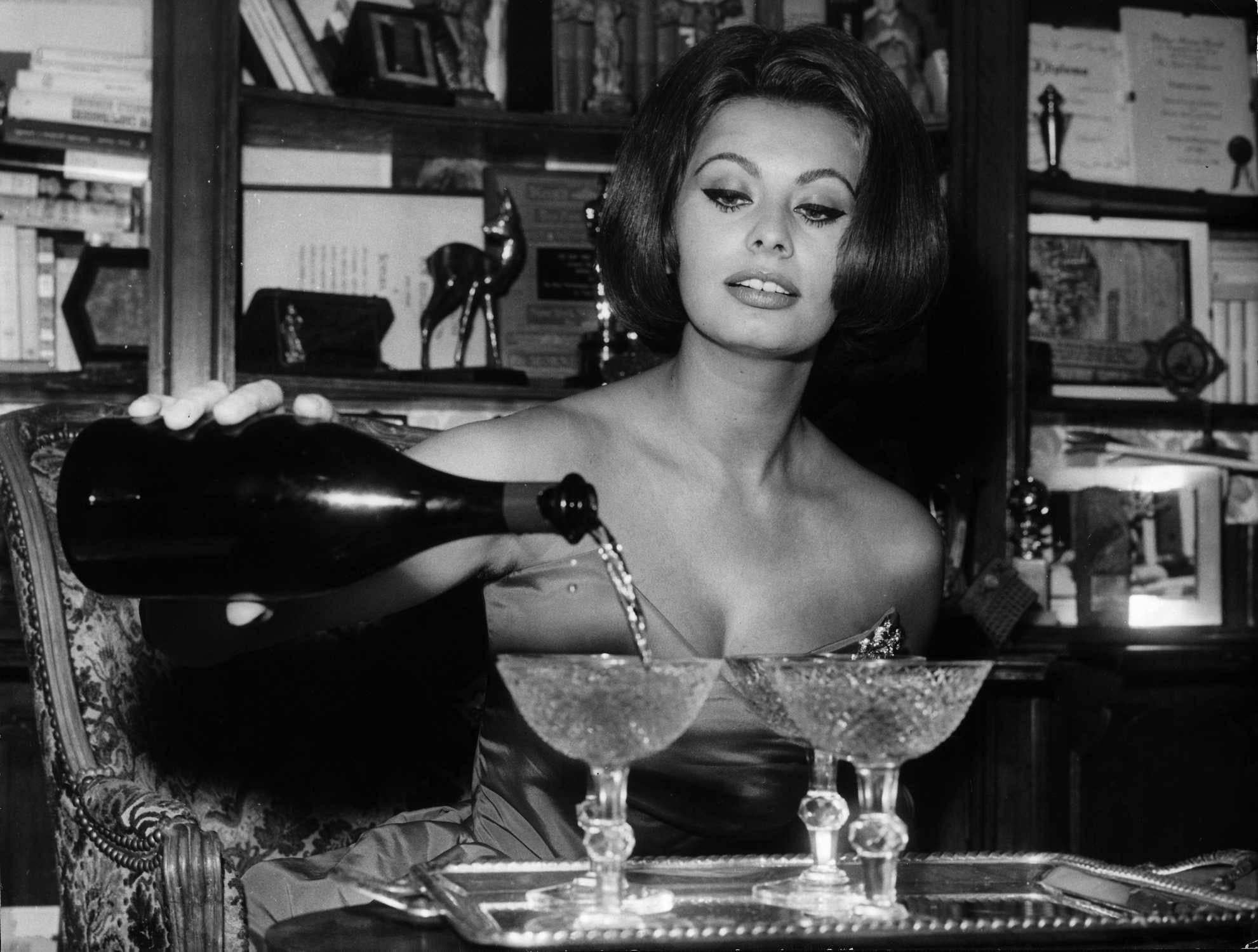 Unknown Portrait Photograph - Sophia Loren Pouring Champagne on New Year's Eve Fine Art Print