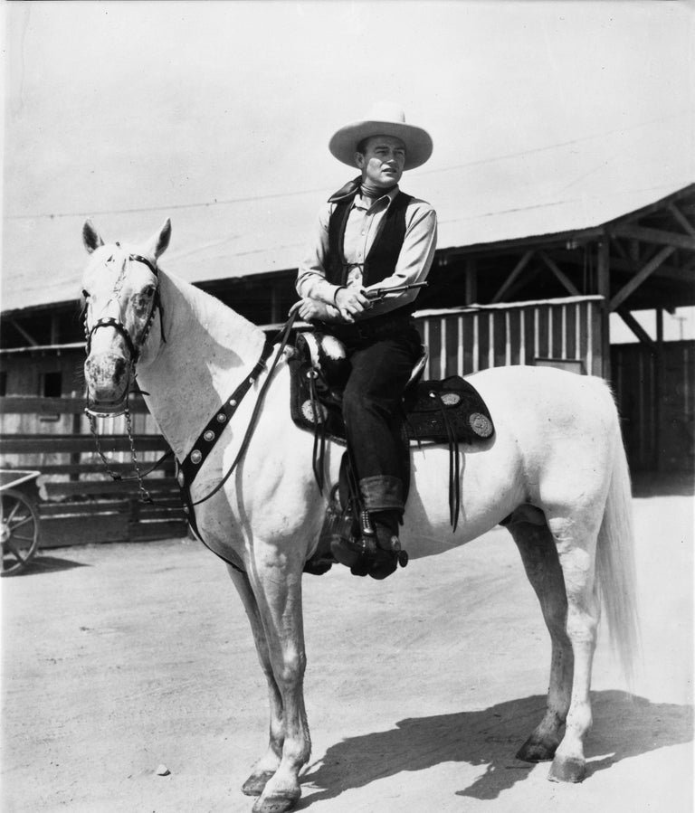 Unknown Portrait Photograph - John Wayne Riding a Horse Fine Art Print