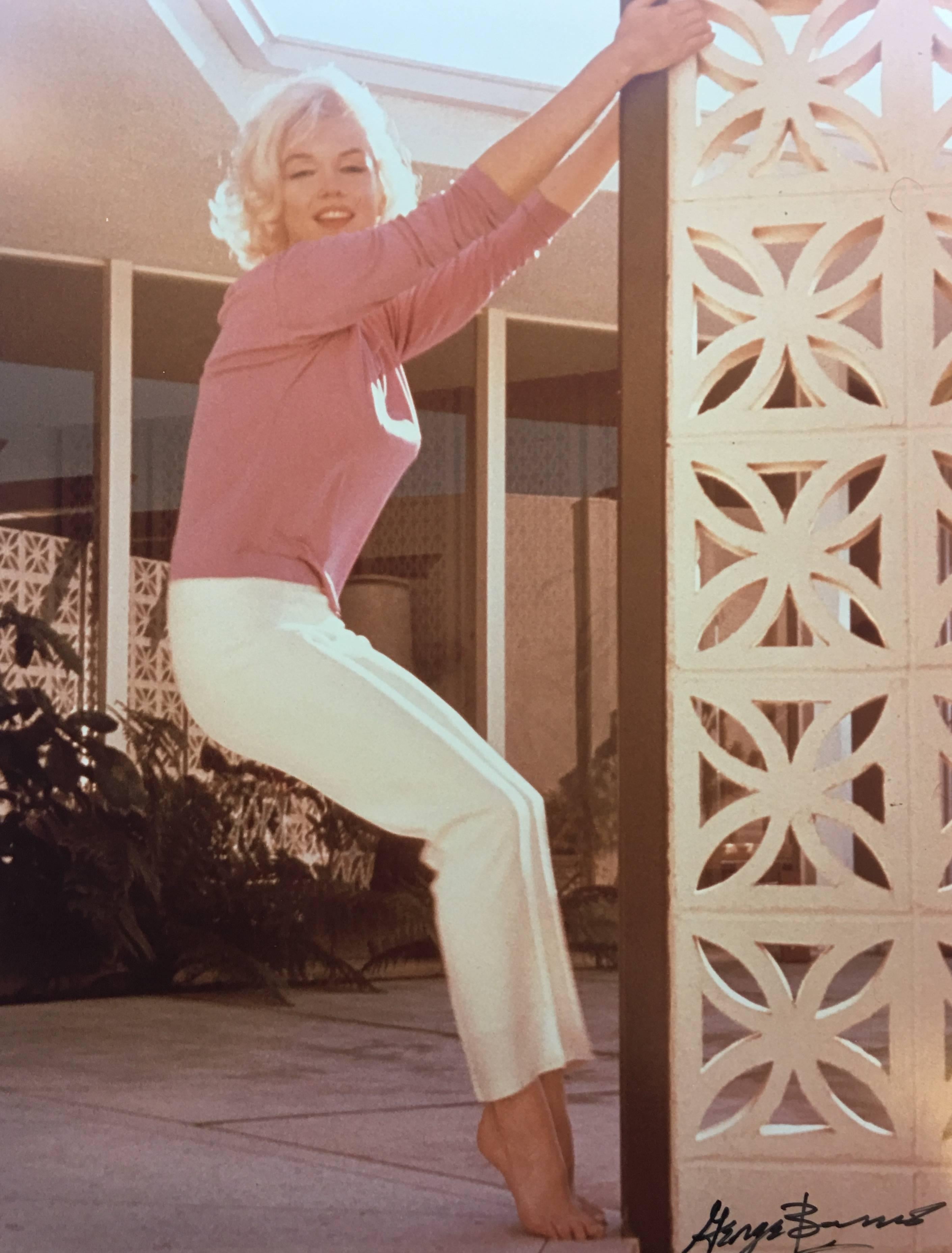 This photograph of Marilyn Monroe was shot by photographer, George Barris, in 1962 at the North Hollywood home of Barris' close friend.  Taken only two weeks before her death, this photograph is part of a series titled "The Last Photos".

This piece