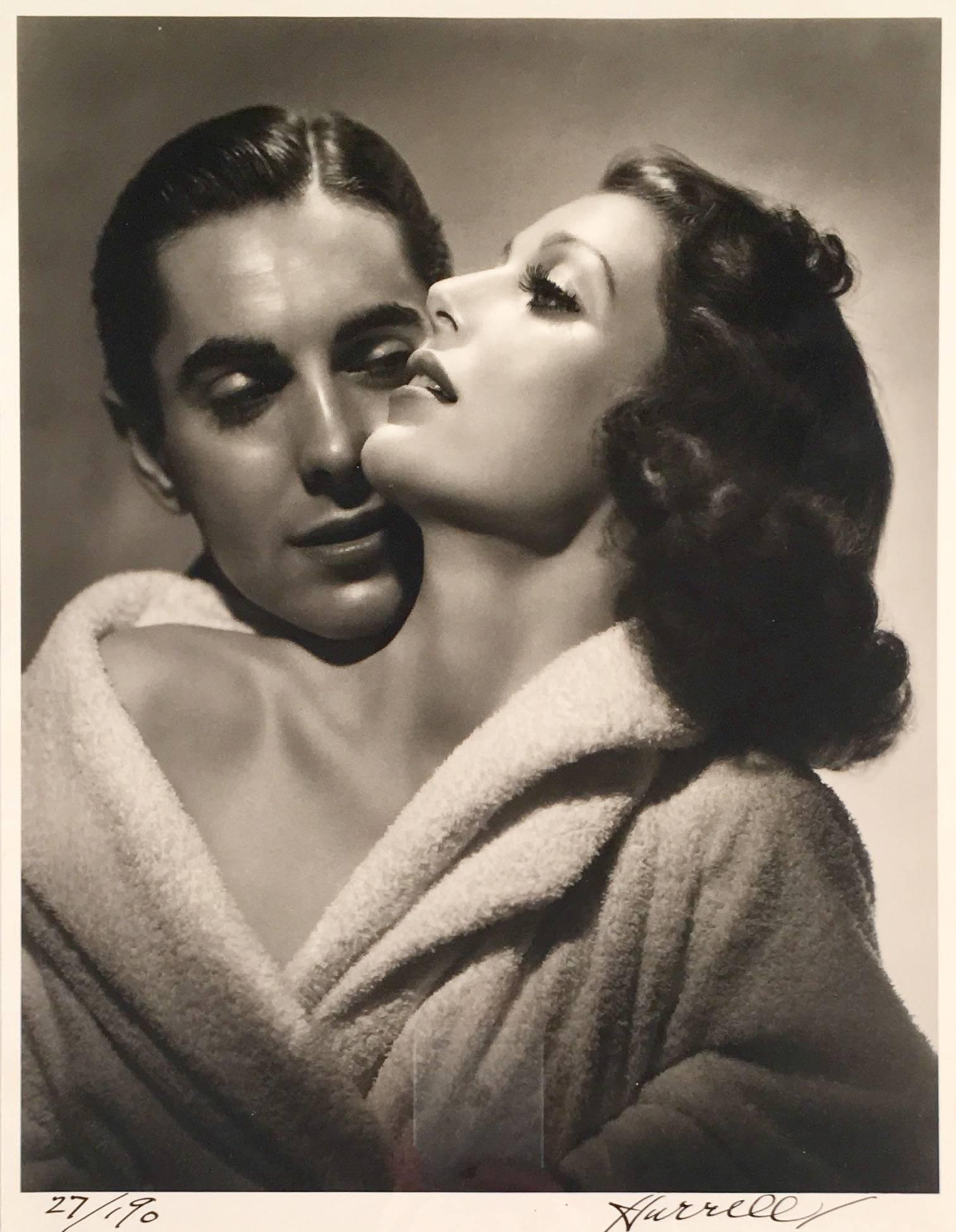 This piece is an original black and white photograph printed from the original negative by George Hurrell, shot in 1937 and printed at a later date. This image depicts "Old Hollywood" actor and actress, Tyrone Power and Loretta Young, in promotion