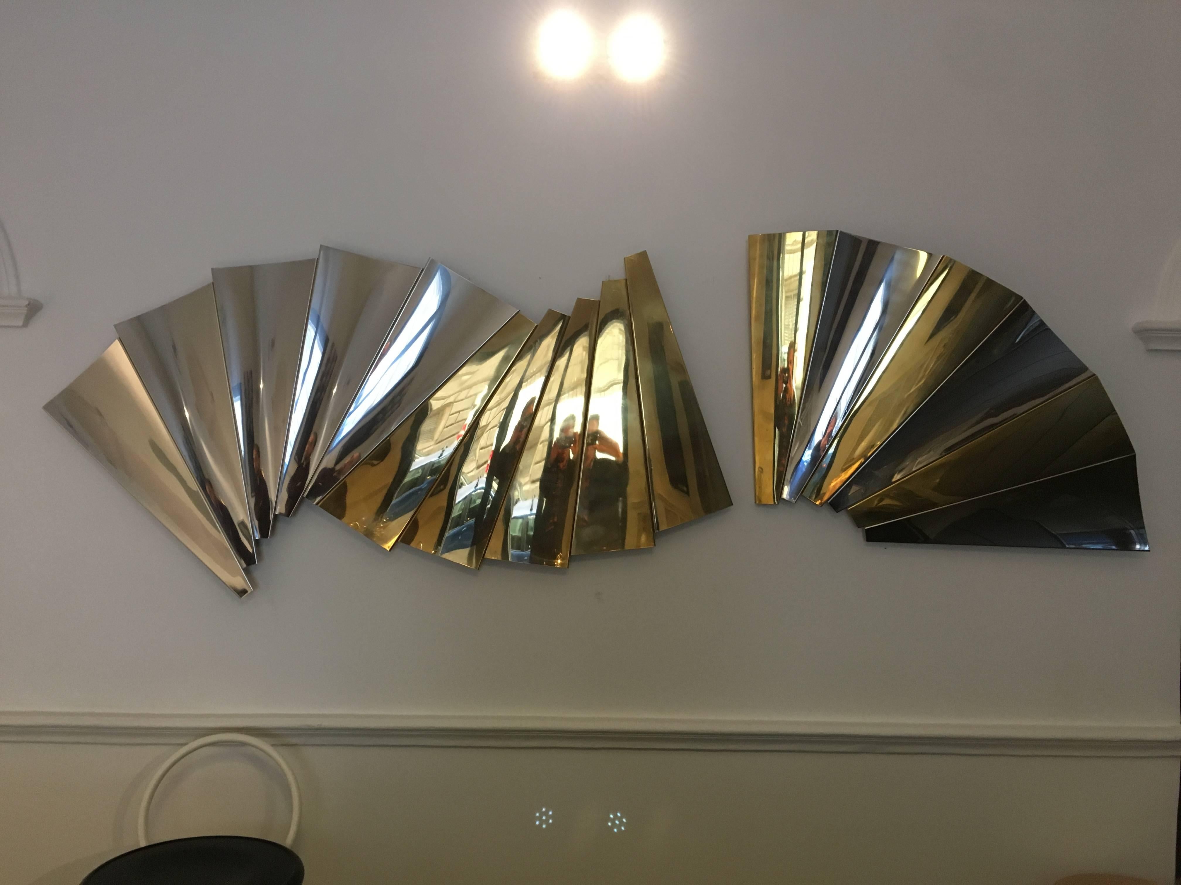 Wall-mounted sculpture of brass and polished chrome, by Curtis Jere, 1985
