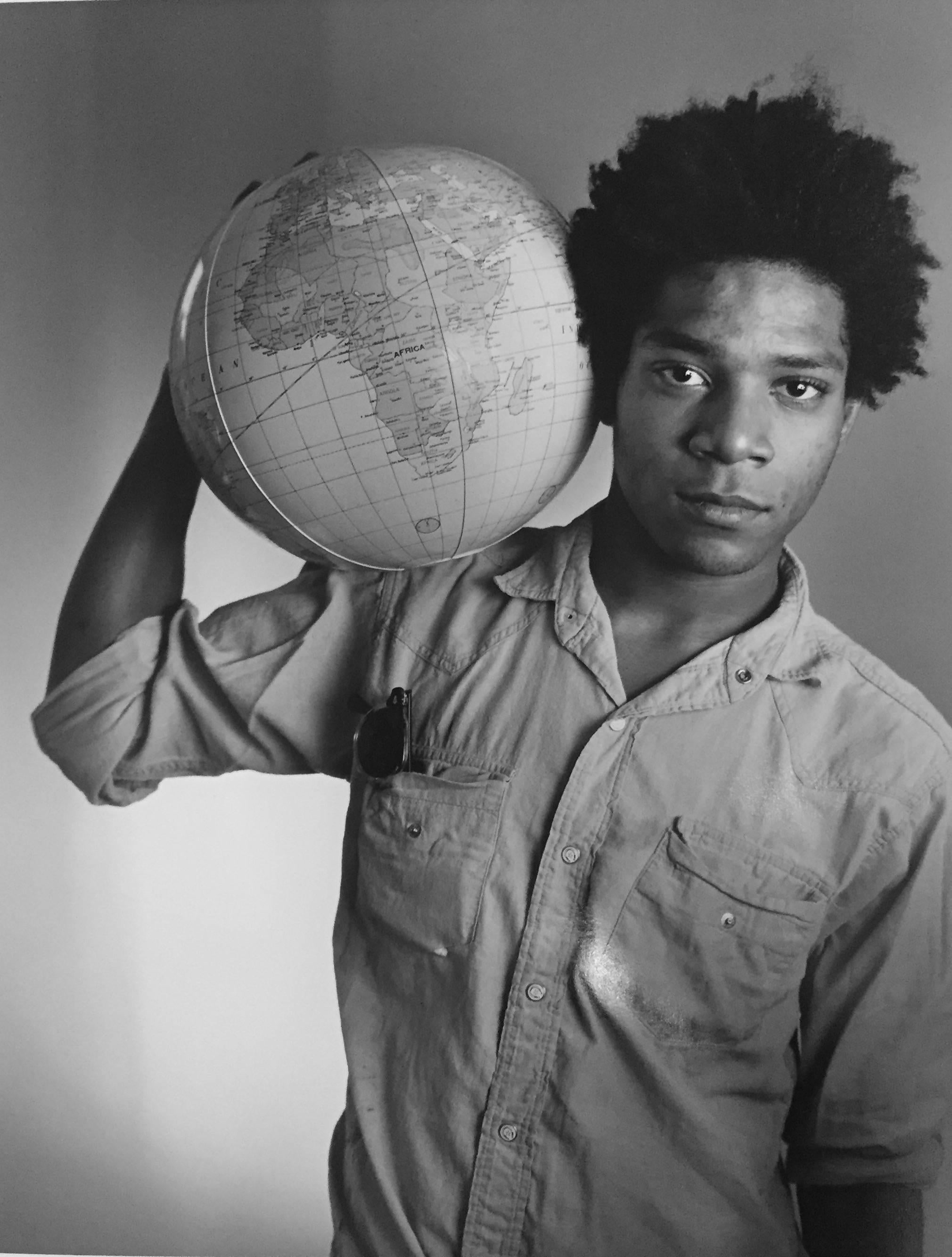 Untitled (Basquiat with Globe), Edition of 250 - Photograph by Christopher Makos