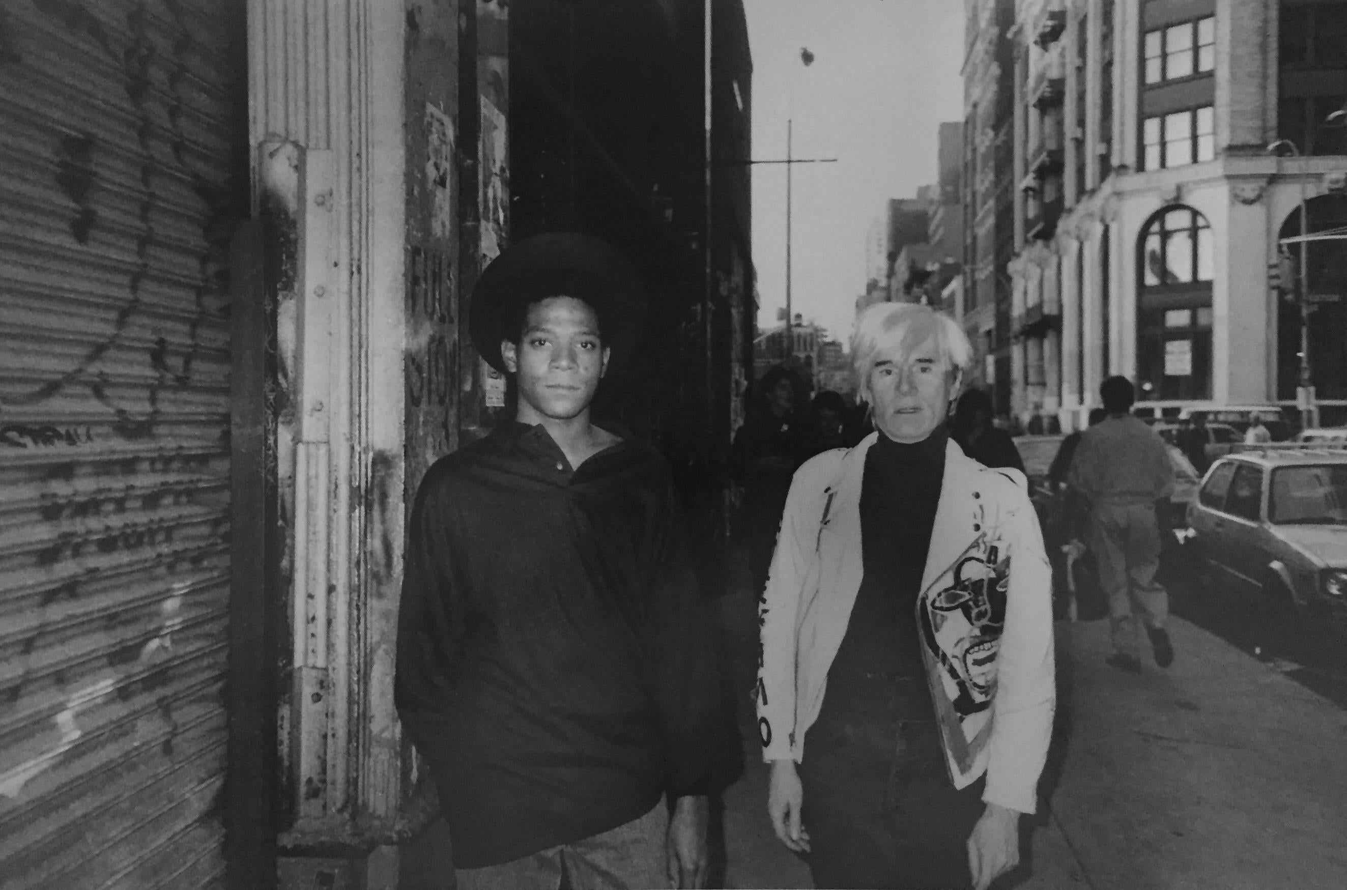 Ricky Powell Black and White Photograph - Andy Warhol and Jean-Michel Basquiat, Mercer Street, 1985 Edition 250