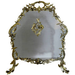 French Polished Brass Fire Screen Adorned with a Center Shell, 19th Century