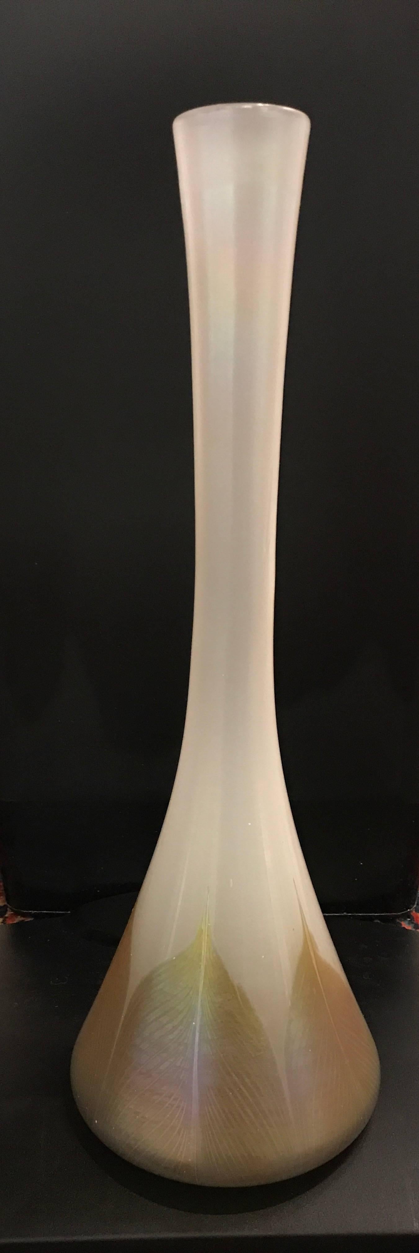 Large Antique Louis Comfort Tiffany Favrile vase  Crafted by the L. C. Tiffany Studios of fine quality Tiffany patented favrile art glass  Features an iridescent opaque white color with pulled feather decoration on the base  Signed “7844 J L.C.