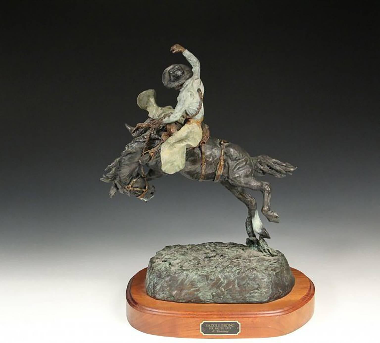 Wonderful Very Limited Edition Bronze Sculpture by Famed Western Sculpture Artist JAY CONTWAY (MT, 1935 – )  Titled “Saddle Bronc”  Beautiful painted cast bronze  Artist Signed on base and numbered 10/24  Mounted on a wooden base with a built-in