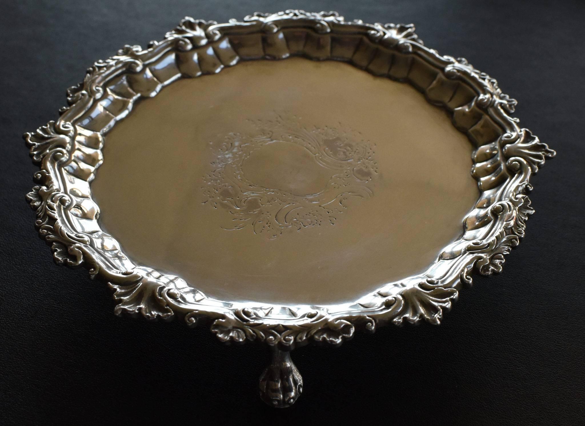 Fine Antique George III Sterling Silver Salver with an armorial engraving in the middle top of the Salver  Measures 7 1/8 inches and 10.5 Troy Ounces  Dated 1747
