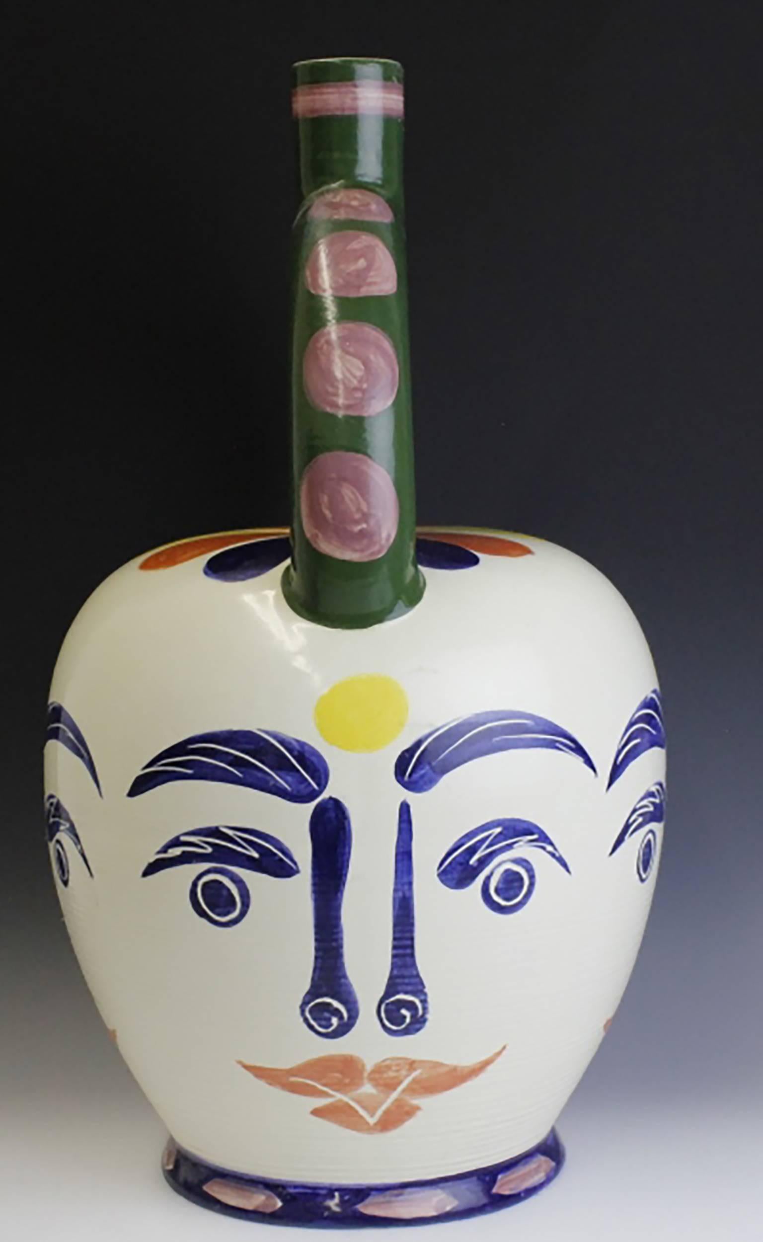Splendid Large Limited edition pottery vase by Padilla pottery after the work of Pablo Picasso  Features a half hoop top with bee hive style base  Vase is hand decorated with four faces with bright colors  Pottery is signed on interior  Measures