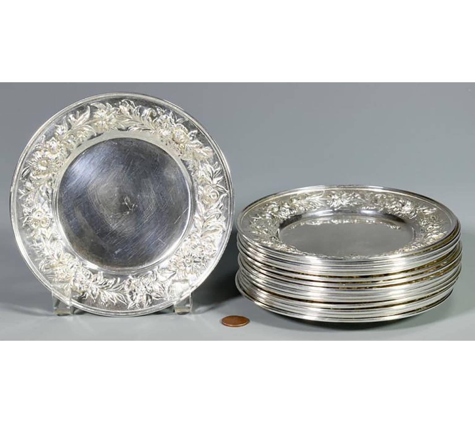 Beautiful Grouping of 14 Kirk Stieff Repousse pattern sterling silver bread and butter plates  Underside has maker’s mark of Kirk Stieff and the pattern number 127F  Measures: 6 1/4″ in diameter   Weight: 56.655 total troy ounces  From the Estate of