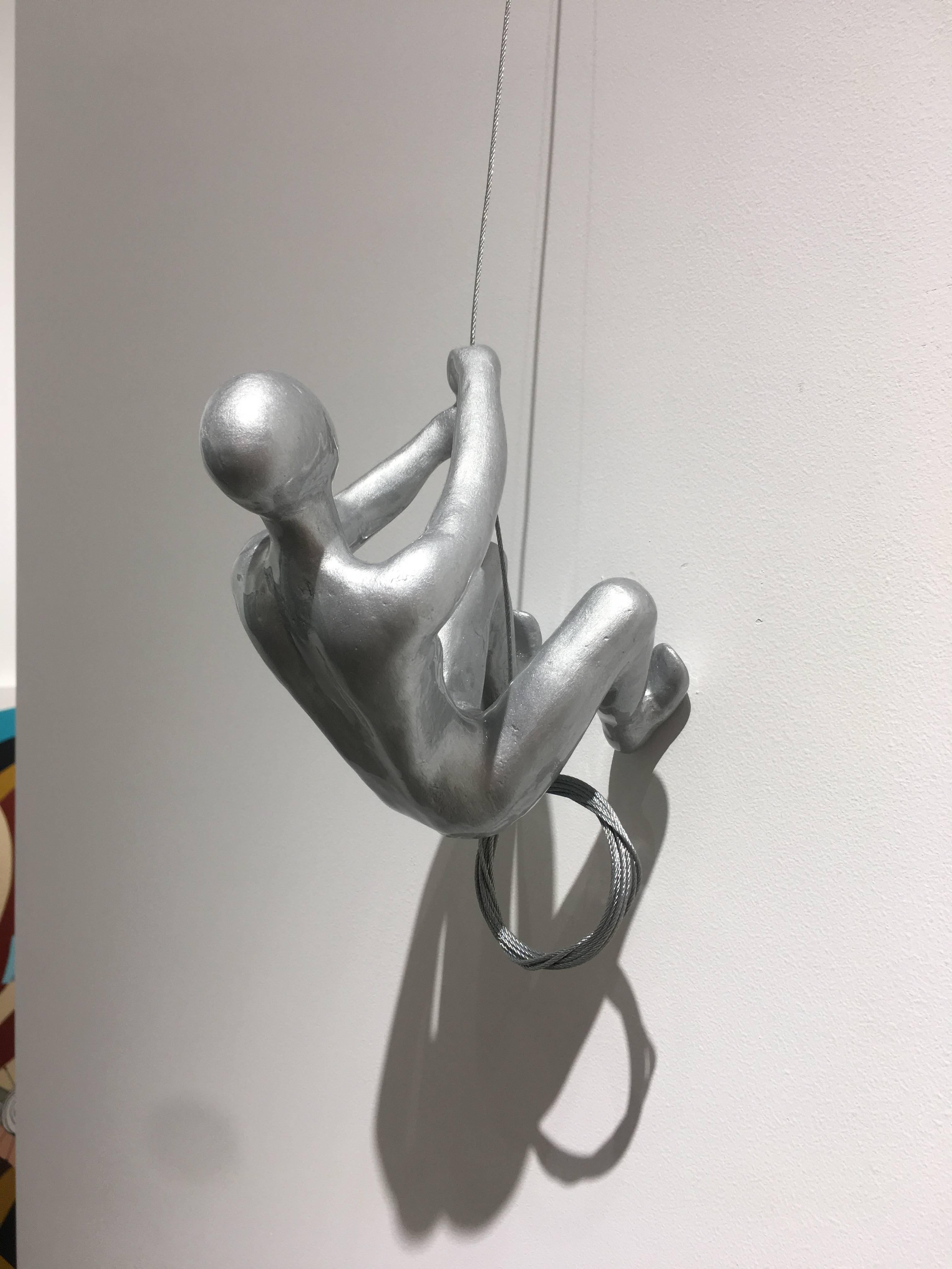 Silver Climber
MARIN
10" x 6" 
Fiberglass and volcanic rock
Easy to hang, ready to install
Comes with steel cable, small screw, and white cap

Commissions Available

MARIN
Born in Colombia, Marin first received formal art training in the 1980s at