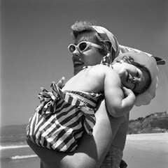 California (Woman Holding Young Girl at Beach), 1955
